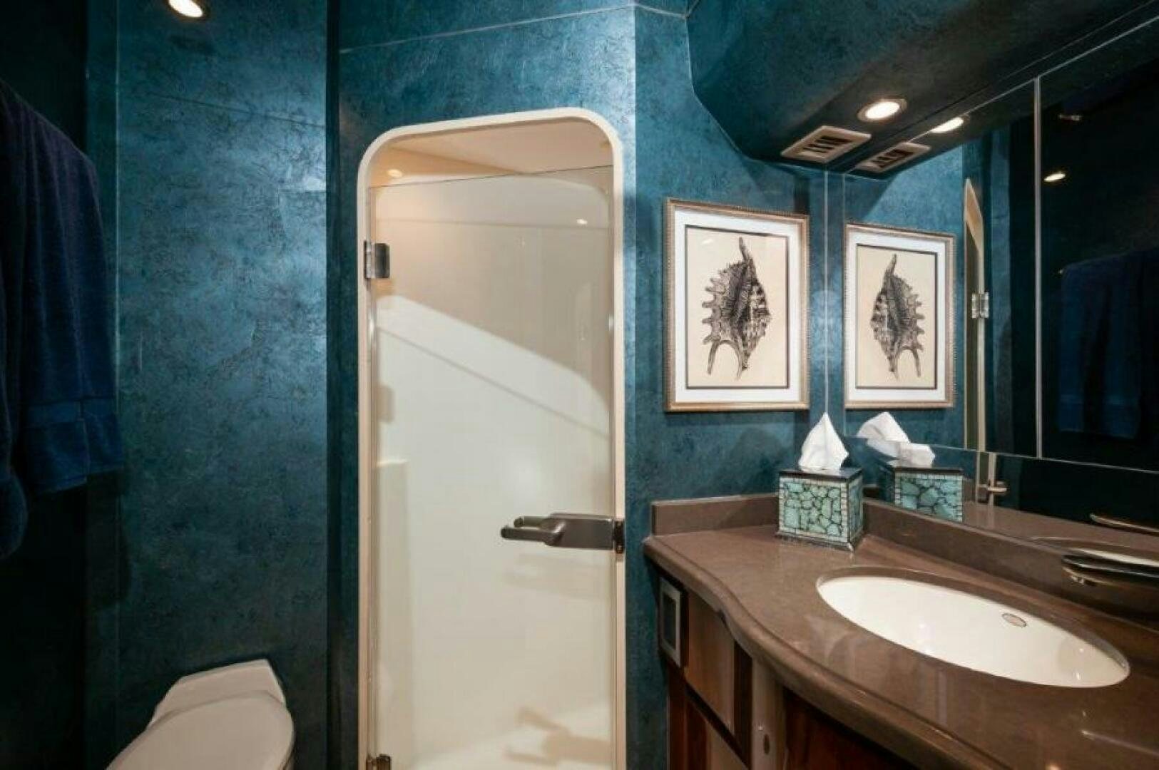 a bathroom with a sink and a mirror aboard POUR INTENTIONS Yacht for Sale