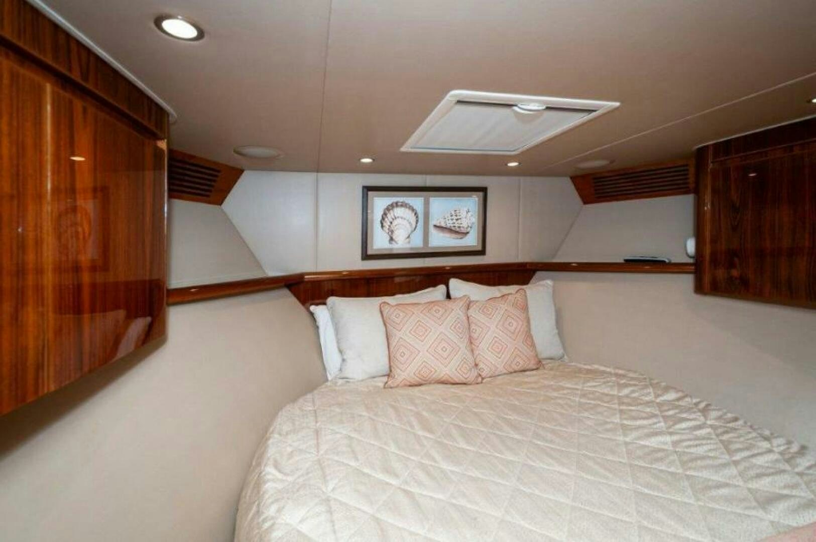 a bed with pillows aboard POUR INTENTIONS Yacht for Sale