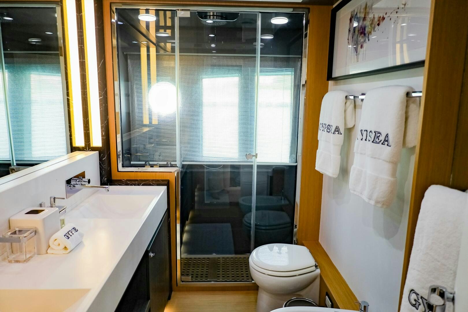 a bathroom with a sink toilet and a bathtub aboard GYPSEA Yacht for Sale