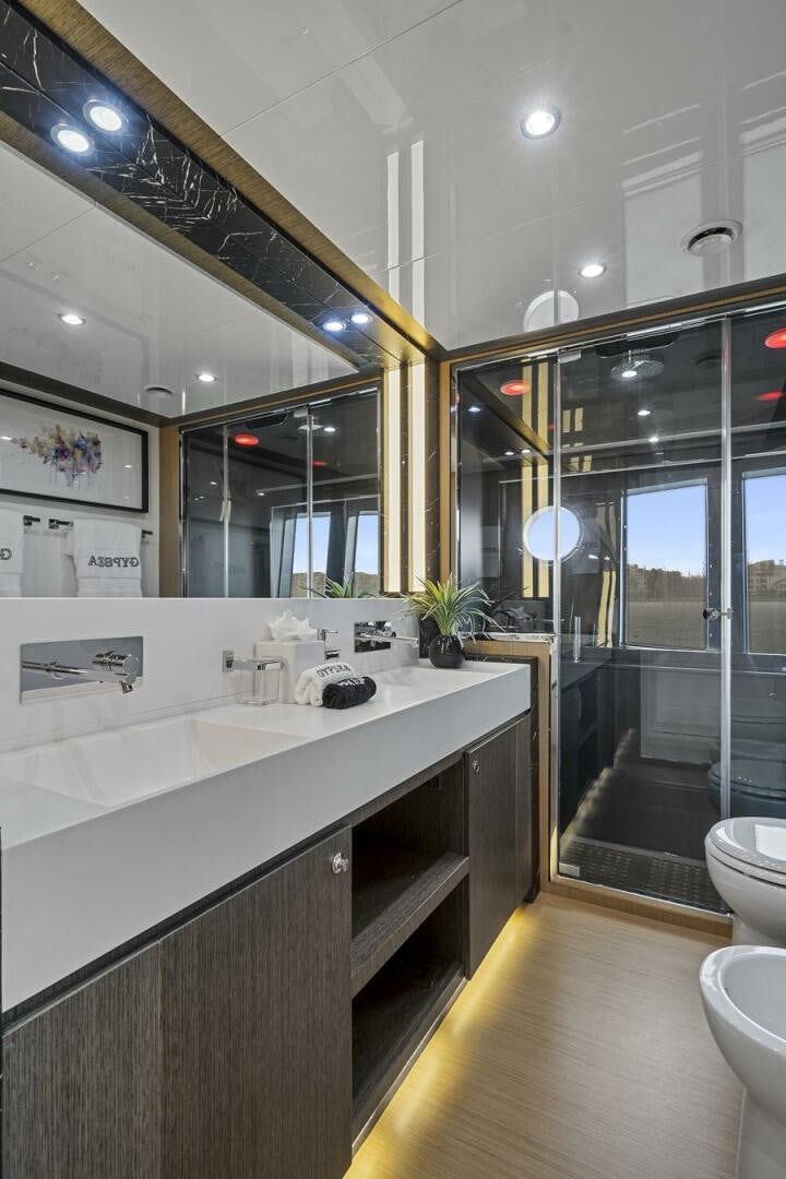 a bathroom with a large mirror aboard GYPSEA Yacht for Sale