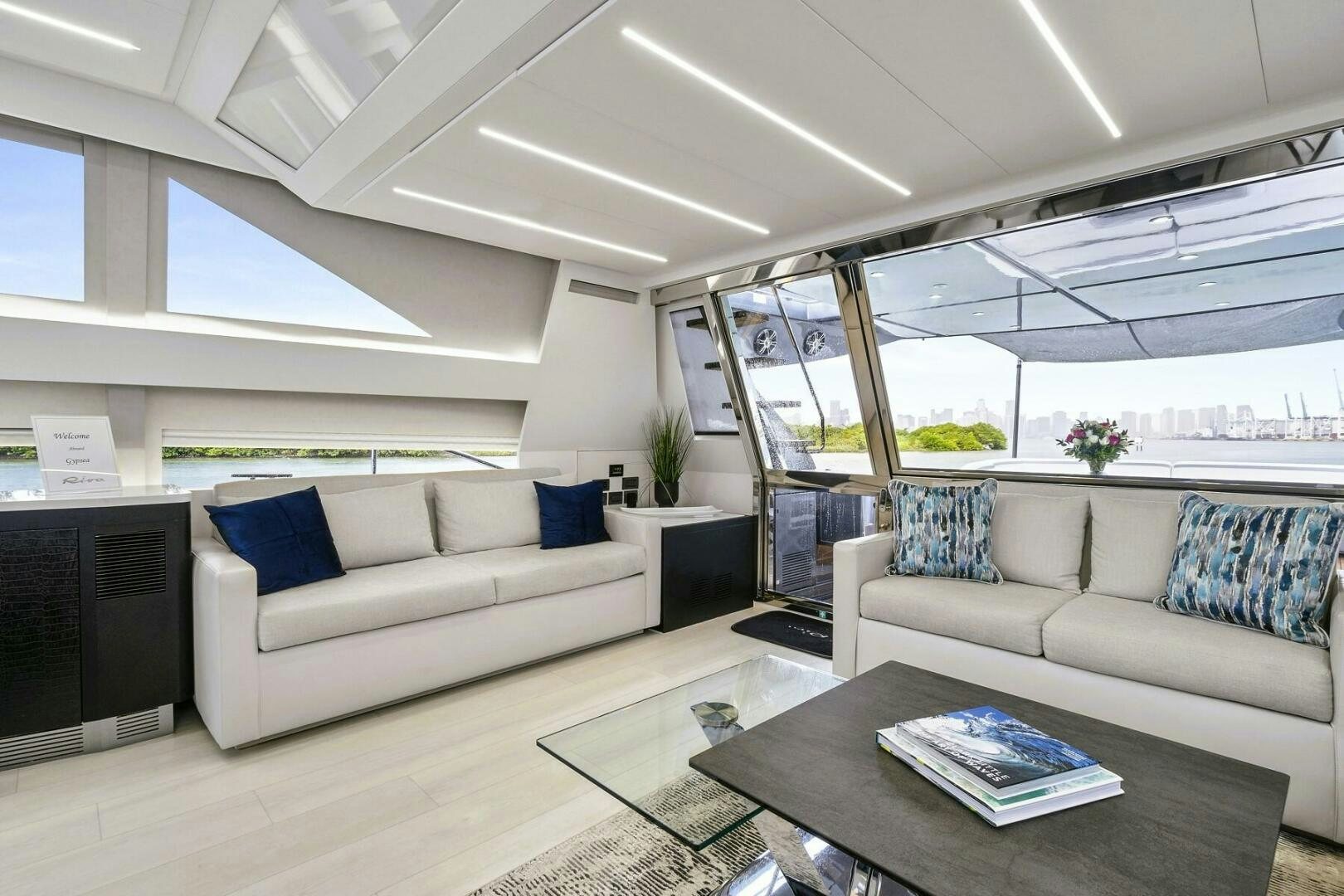 a living room with a large glass window aboard GYPSEA Yacht for Sale