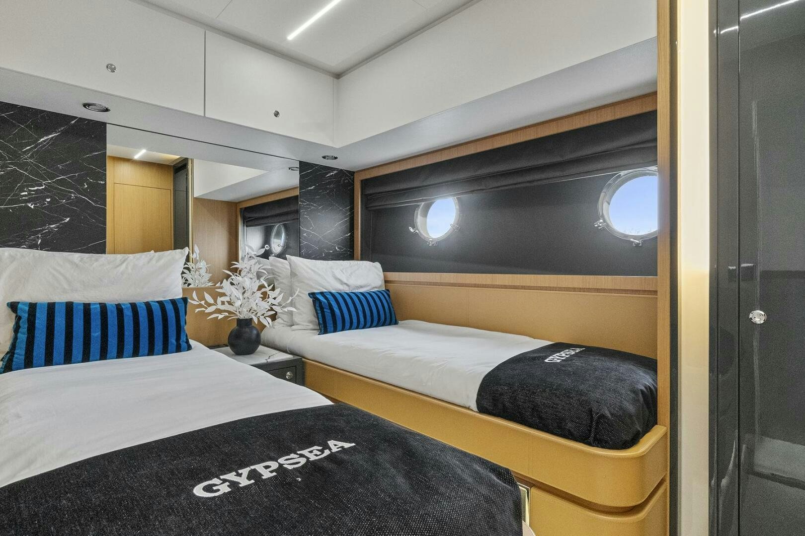a room with two beds aboard GYPSEA Yacht for Sale