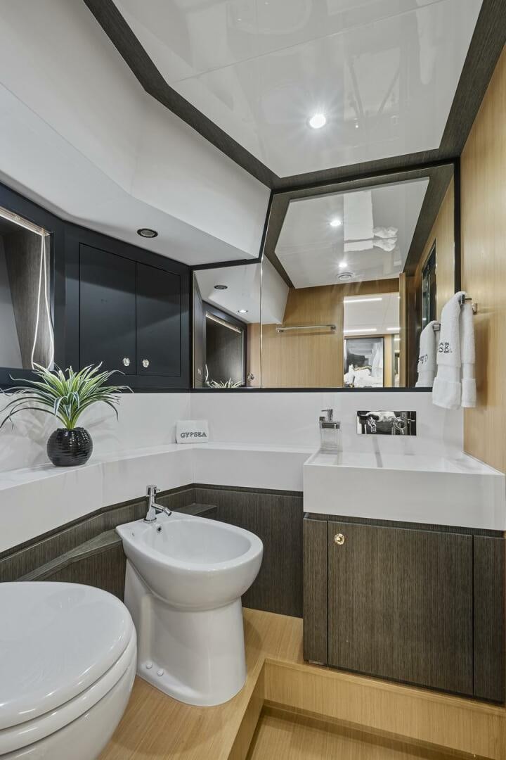 a bathroom with a large mirror aboard GYPSEA Yacht for Sale