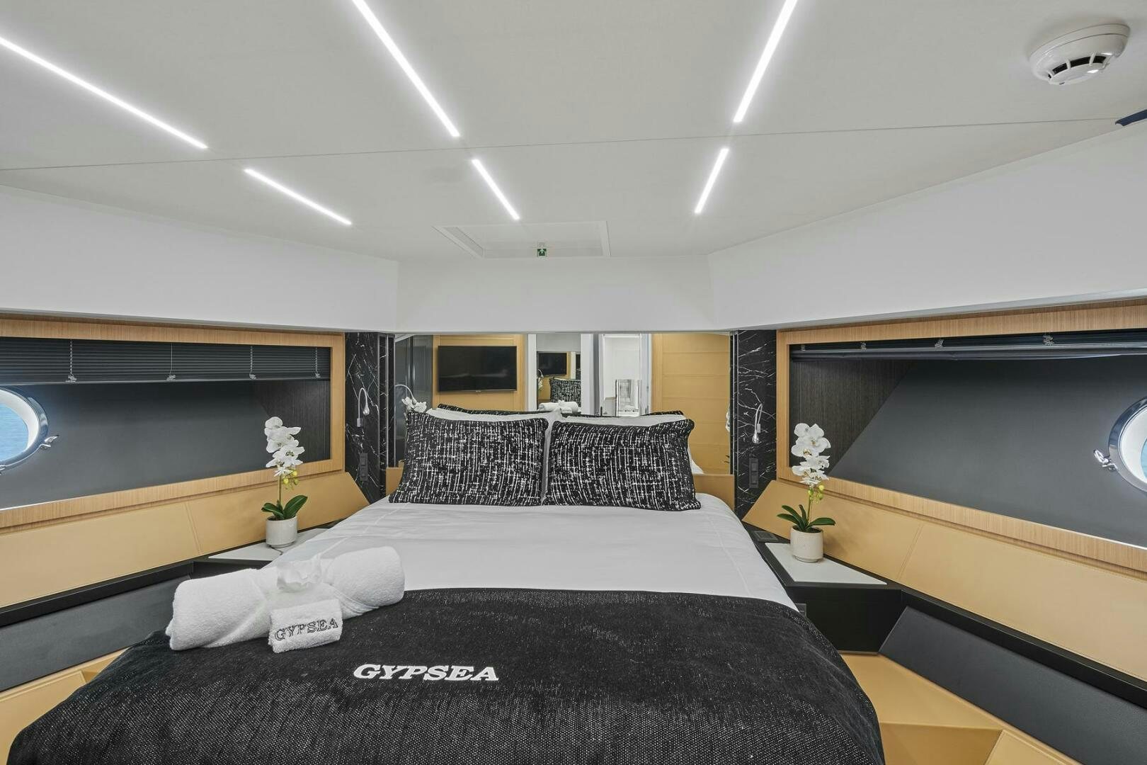 a room with a bed and a desk aboard GYPSEA Yacht for Sale