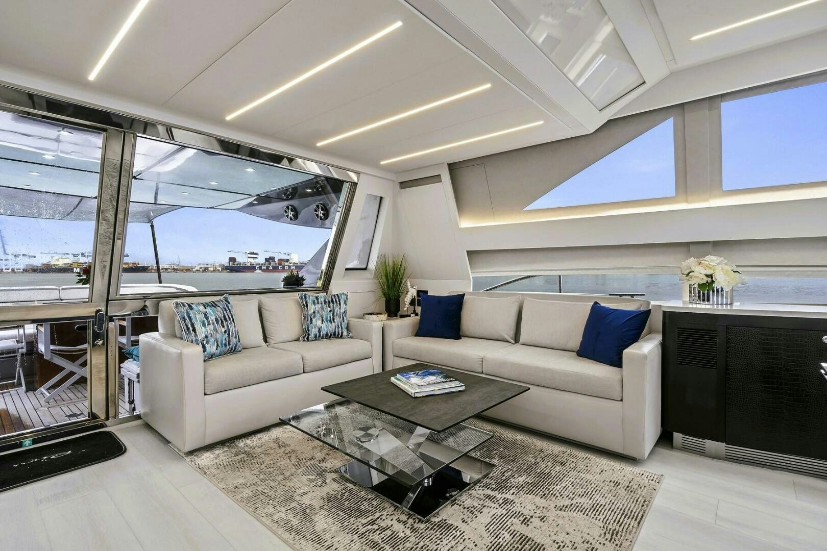 a living room with a large window aboard GYPSEA Yacht for Sale
