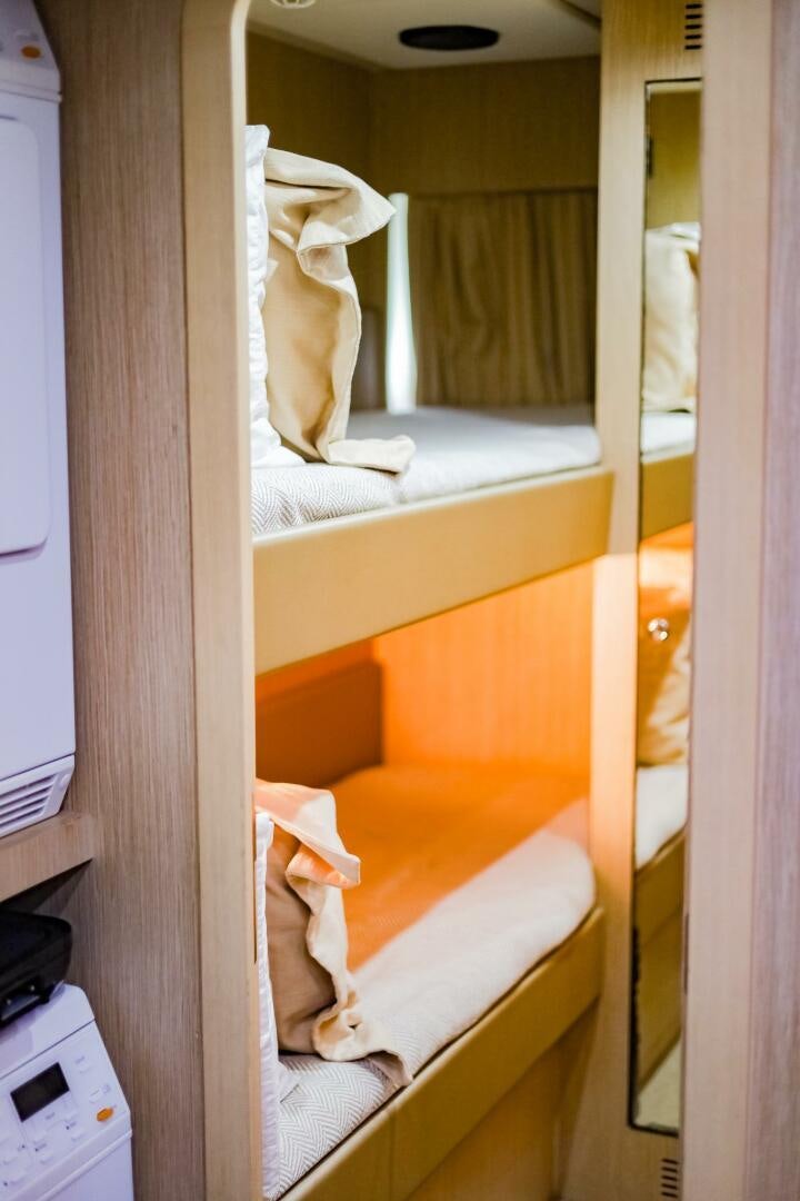 a room with a mirror and a bed aboard GYPSEA Yacht for Sale