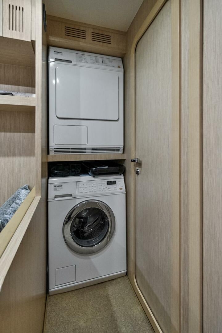 a washer and dryer in a room aboard GYPSEA Yacht for Sale
