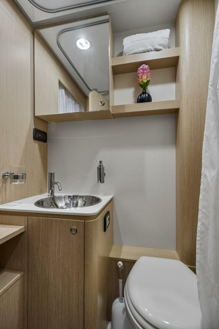 a bathroom with a sink and a mirror aboard GYPSEA Yacht for Sale