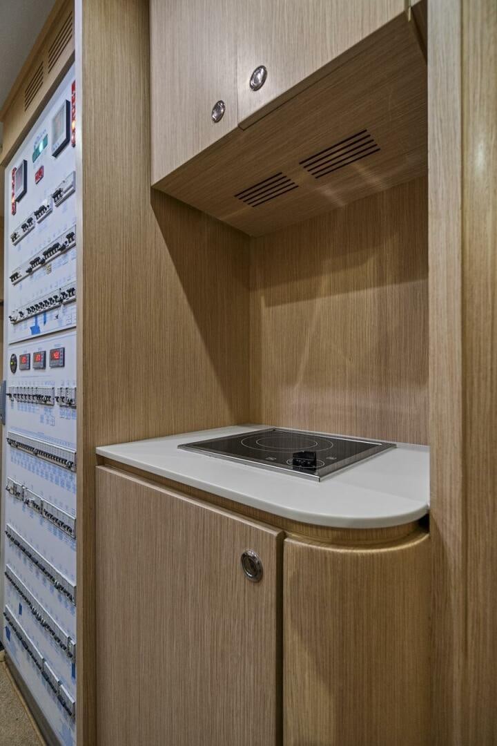 a white rectangular object on a wooden surface aboard GYPSEA Yacht for Sale