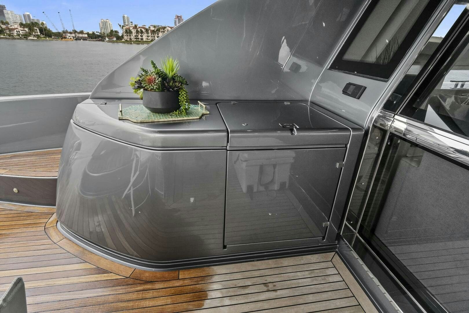 a plant in a pot on a deck aboard GYPSEA Yacht for Sale