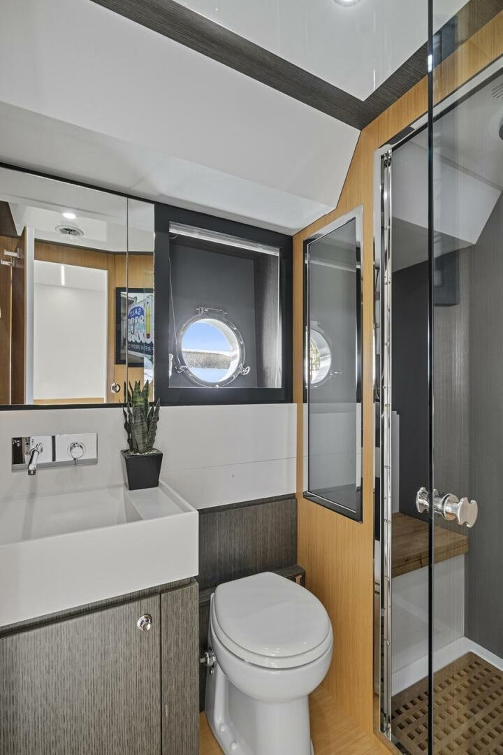 a bathroom with a toilet and a sink aboard GYPSEA Yacht for Sale