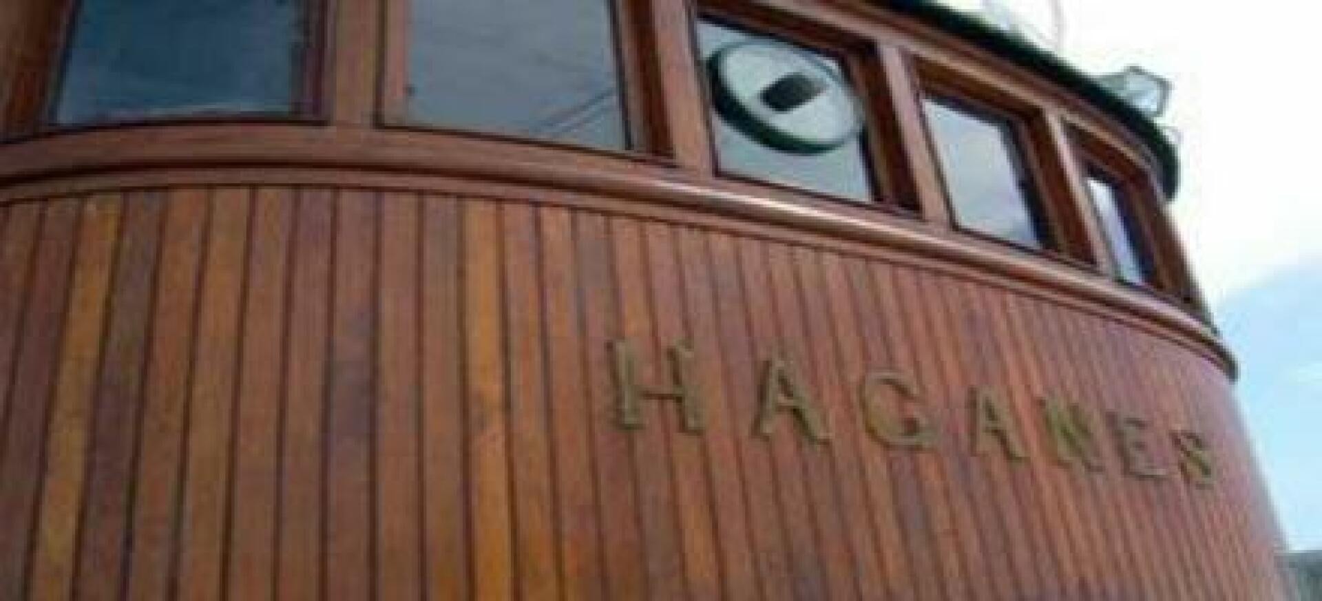 a wooden fence with a sign on it aboard HAGANES Yacht for Sale