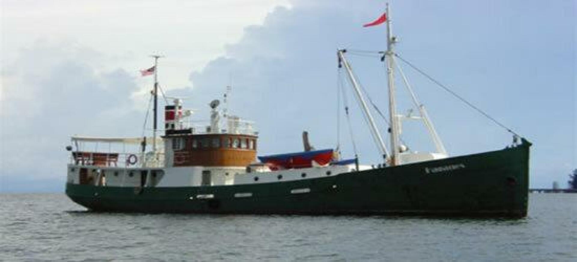 a large ship in the water aboard HAGANES Yacht for Sale