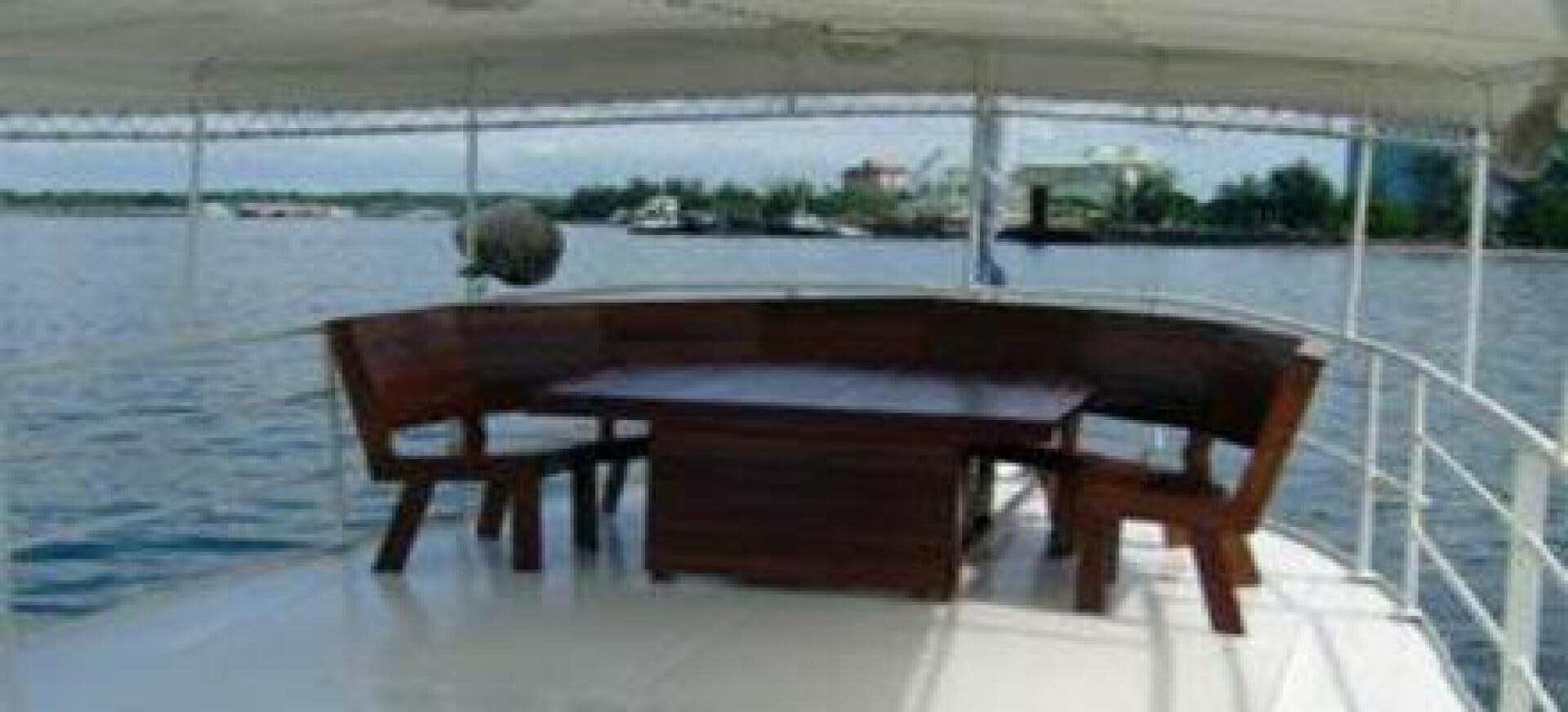 a table and chairs on a boat aboard HAGANES Yacht for Sale