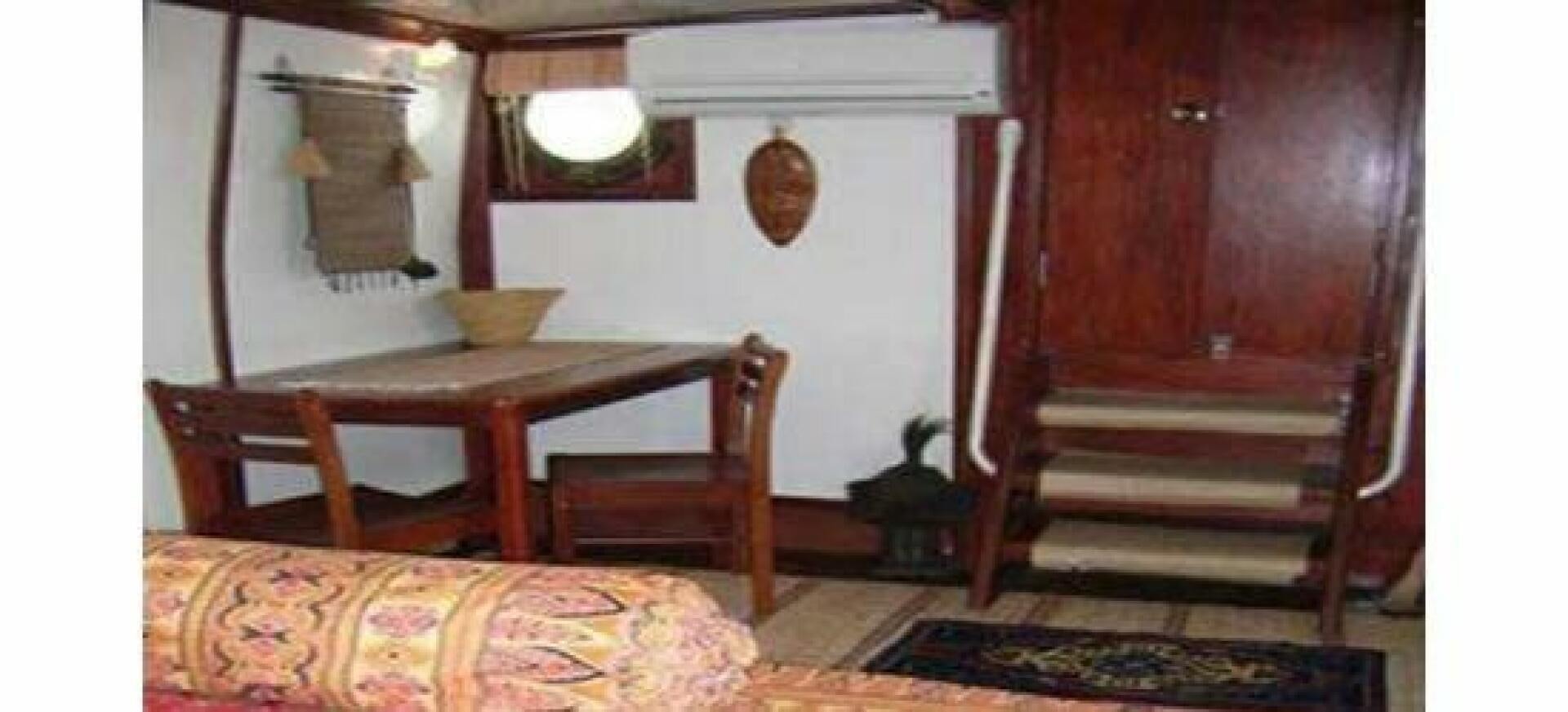 a room with a table and chairs aboard HAGANES Yacht for Sale