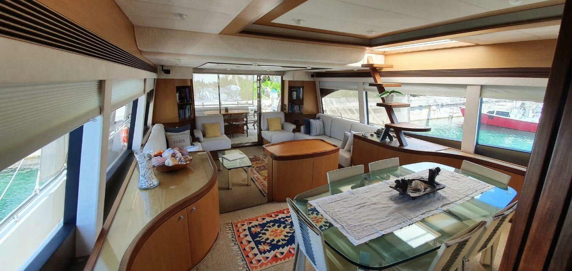a living room with a large window aboard SEDROP Yacht for Sale