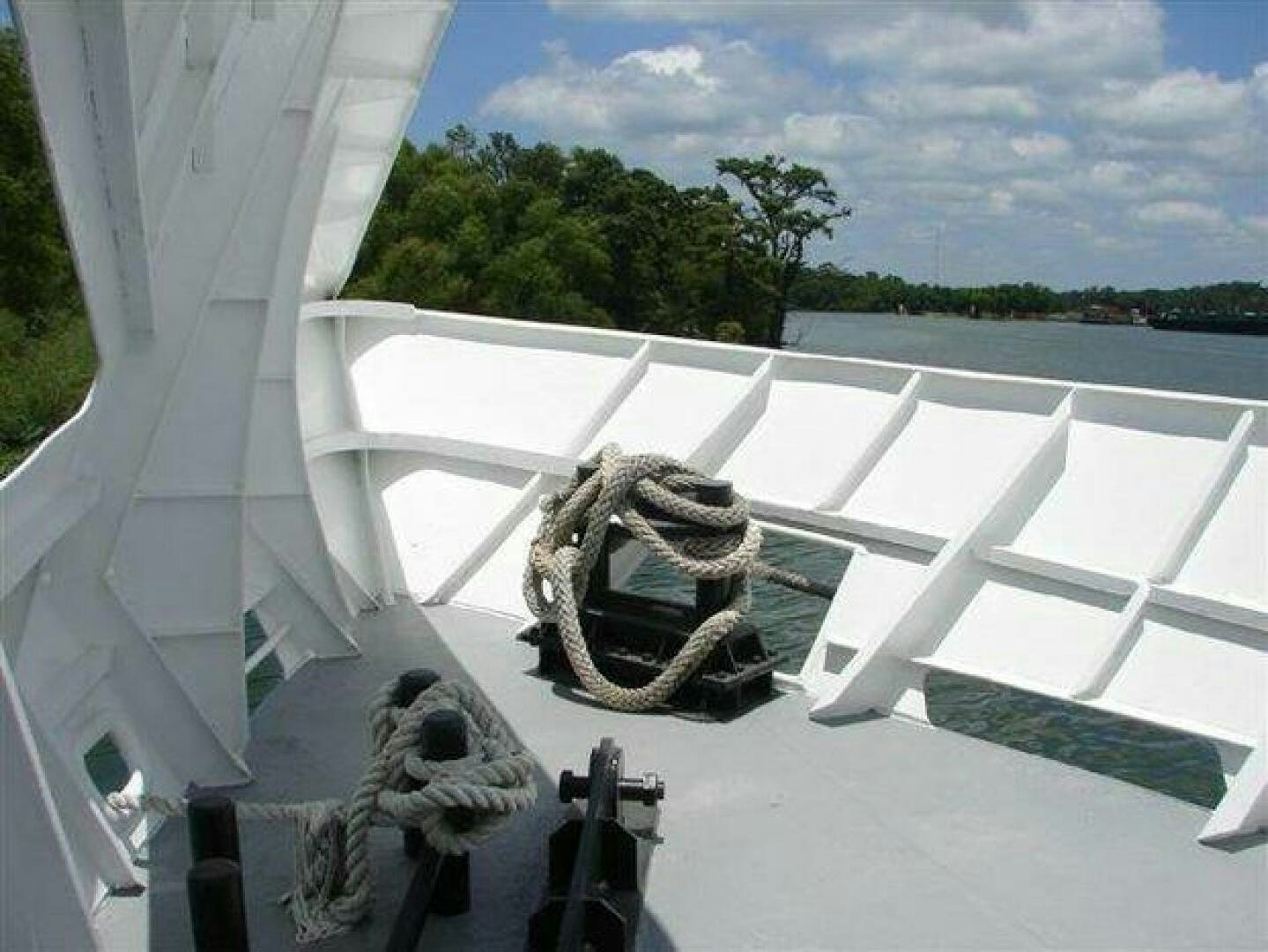a sculpture of a person in a chair on a white chair aboard STILLWATER RIVER Yacht for Sale