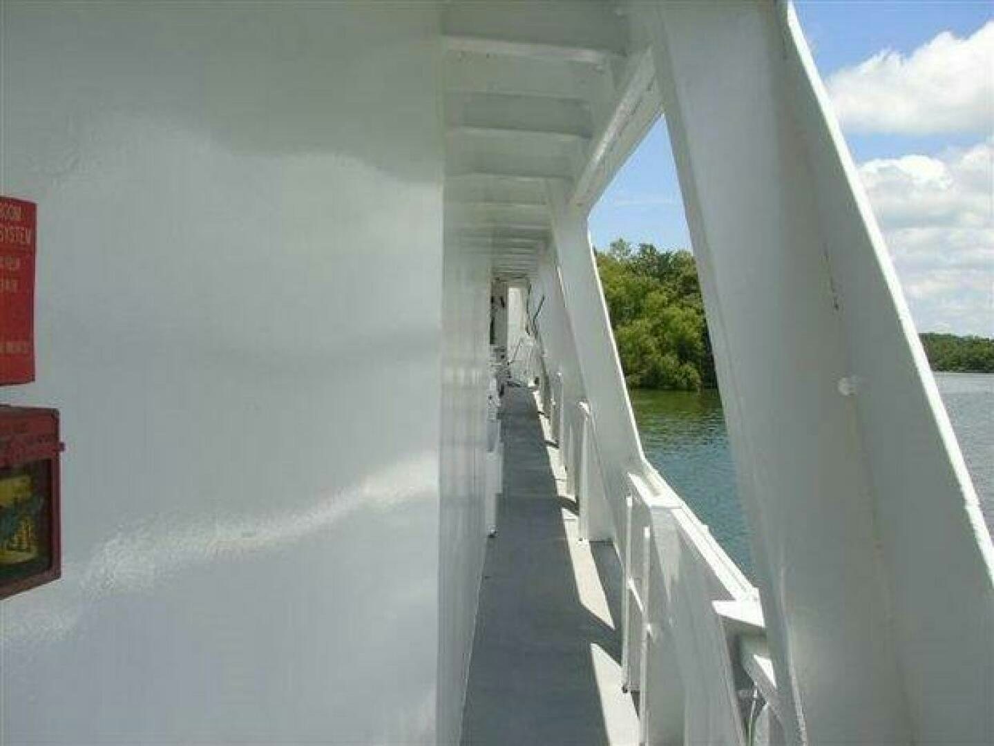 a white bridge over water aboard STILLWATER RIVER Yacht for Sale