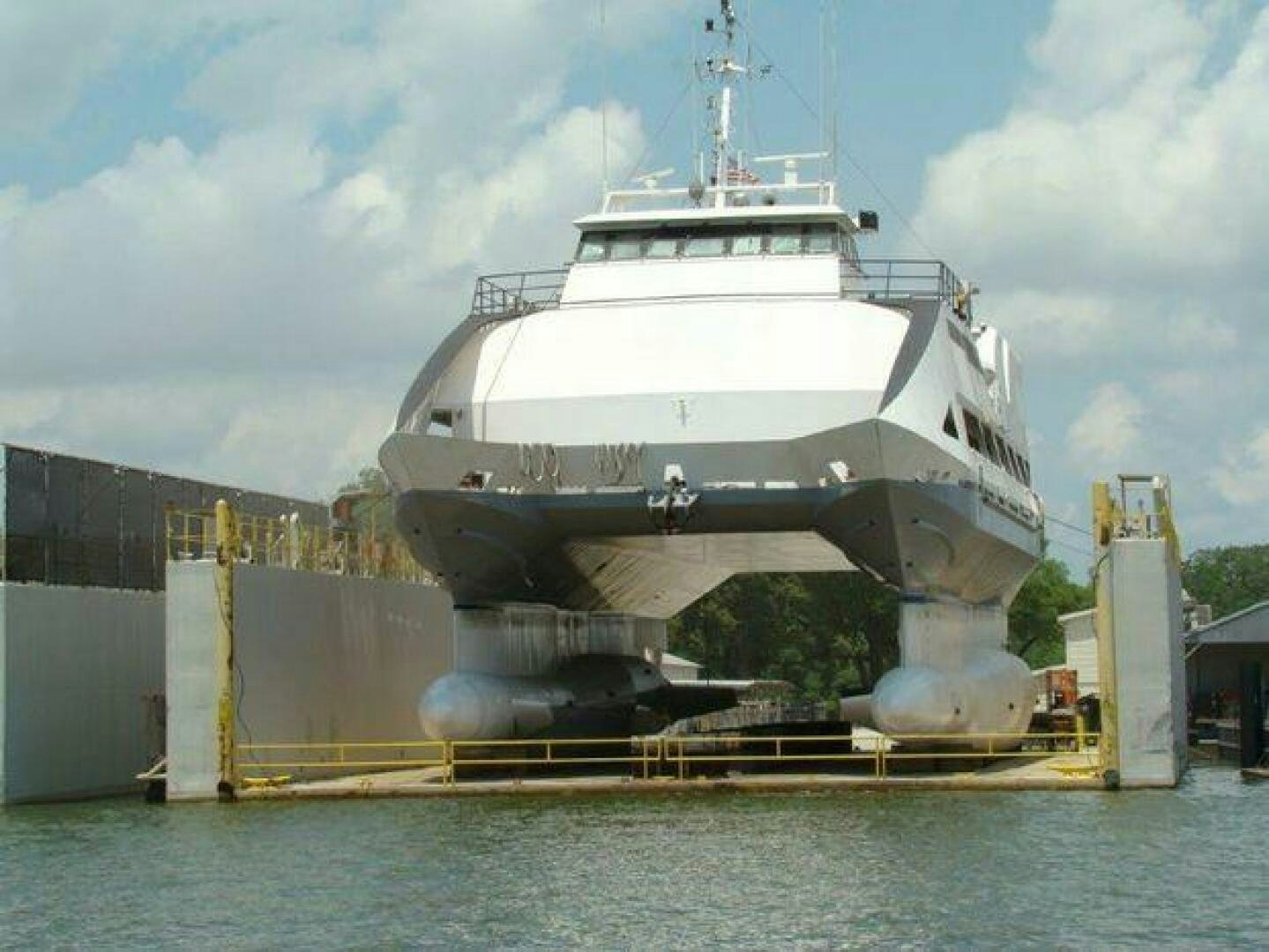 a large white ship docked aboard STILLWATER RIVER Yacht for Sale