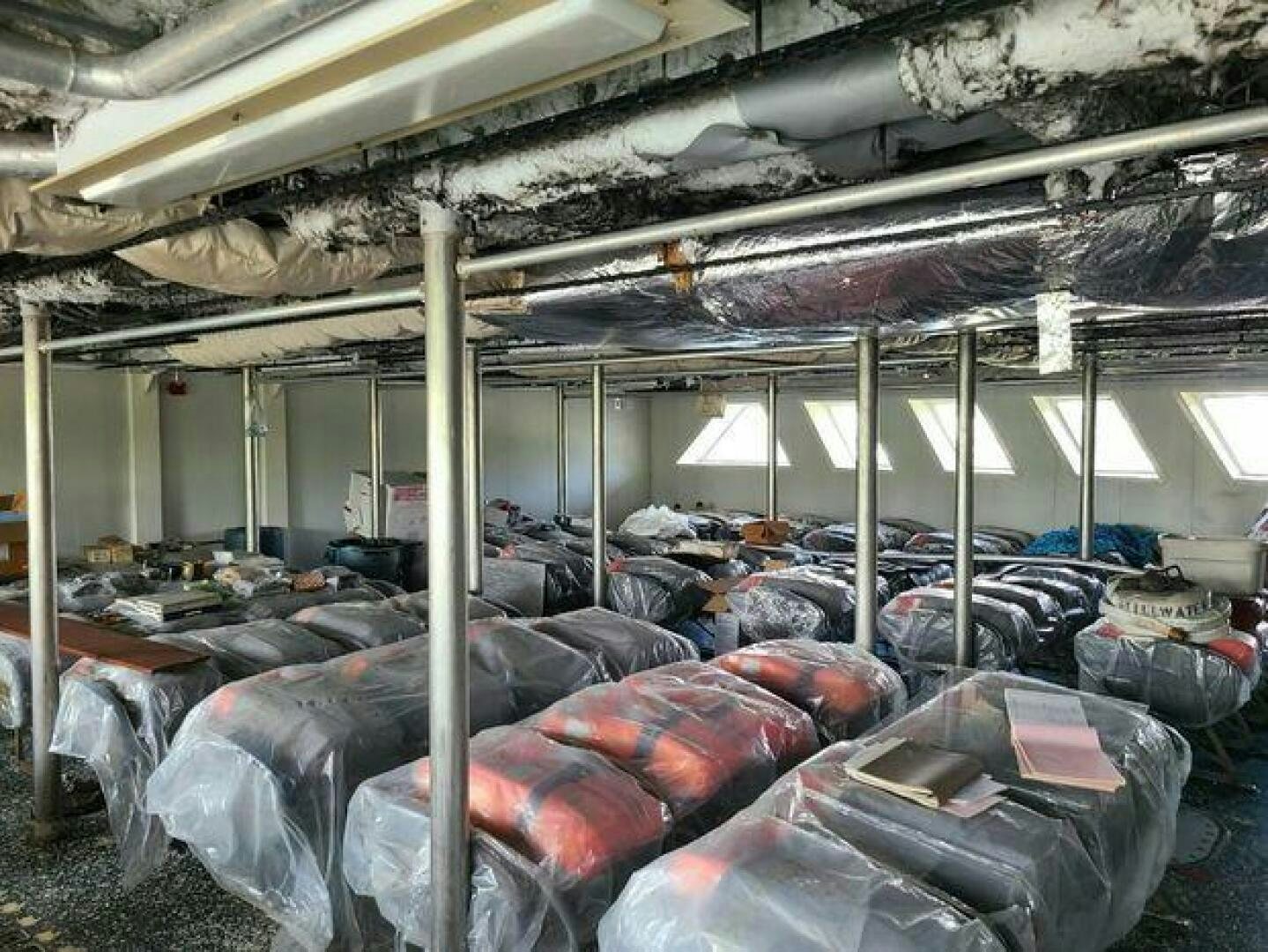 a room full of trash aboard STILLWATER RIVER Yacht for Sale