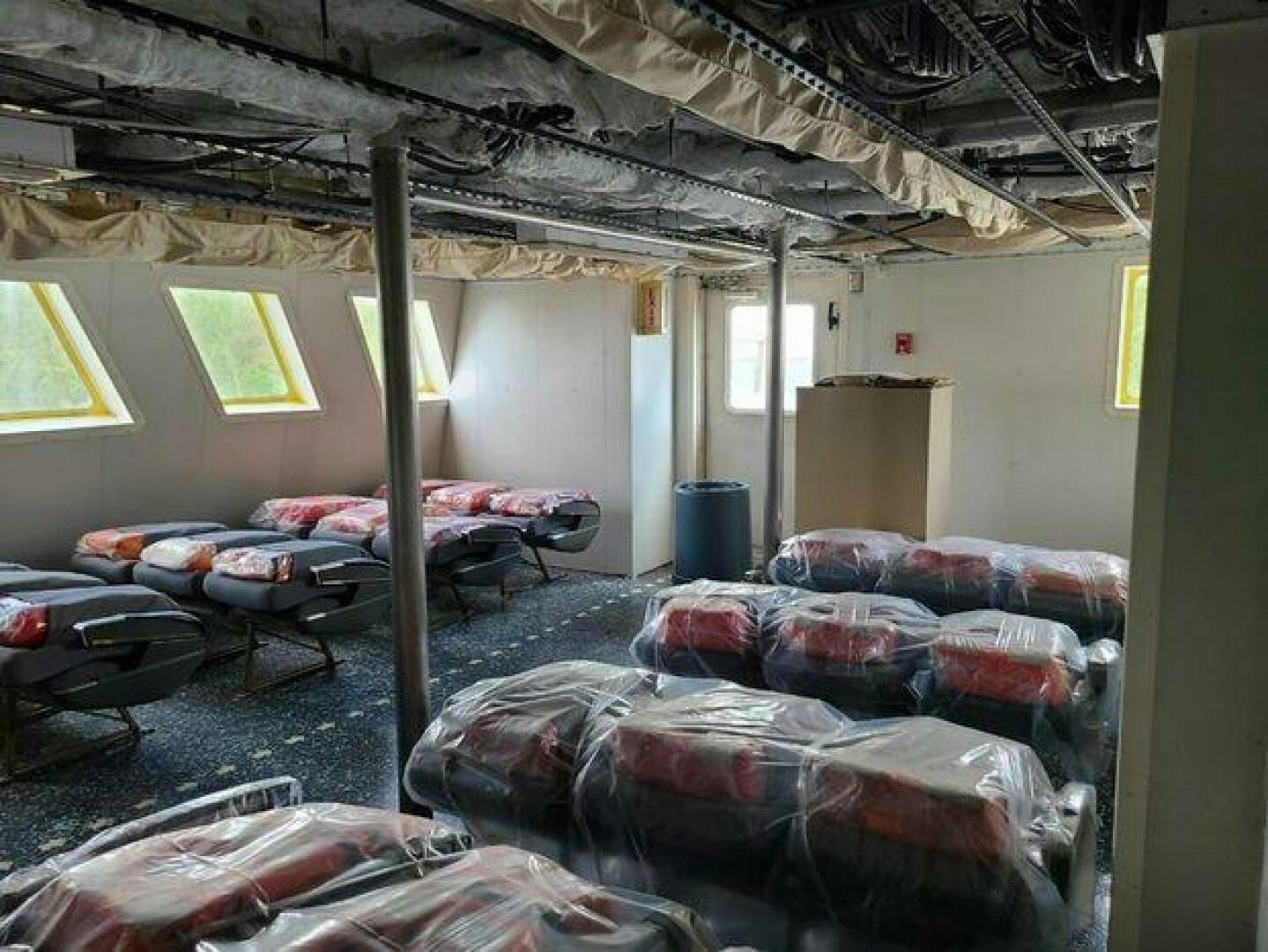 a room with couches and a table aboard STILLWATER RIVER Yacht for Sale