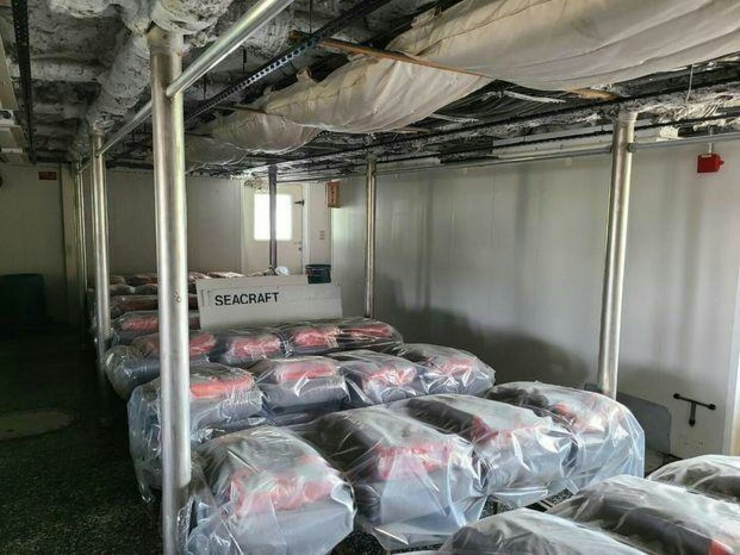 a room with a bed and a white sheet aboard STILLWATER RIVER Yacht for Sale