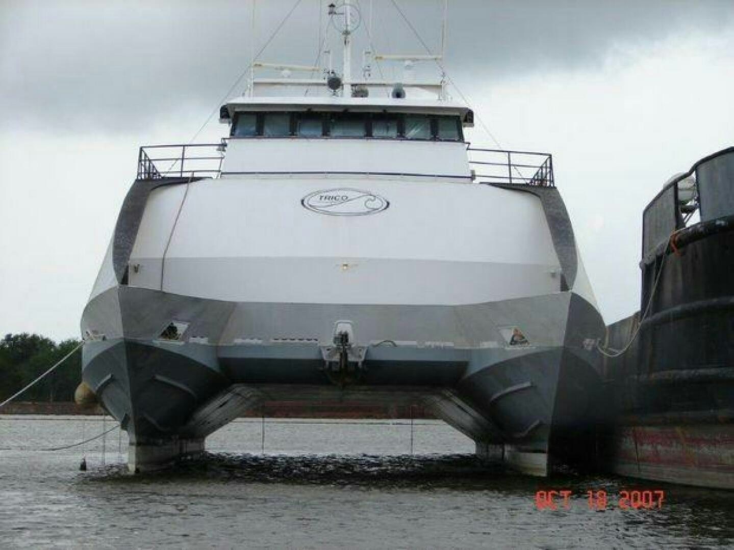 a large boat on the water aboard STILLWATER RIVER Yacht for Sale