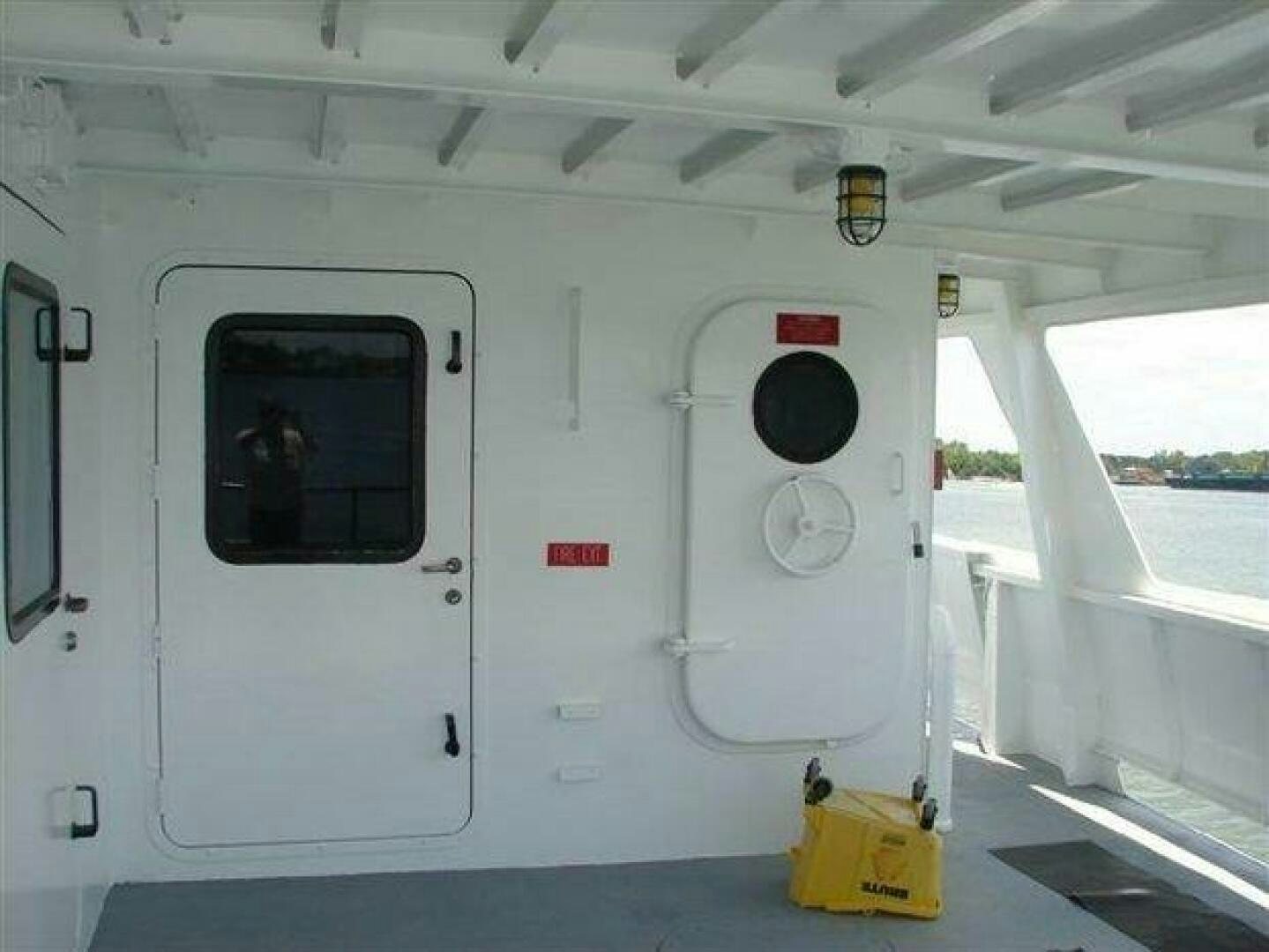 a white vehicle with a black circle on the front aboard STILLWATER RIVER Yacht for Sale
