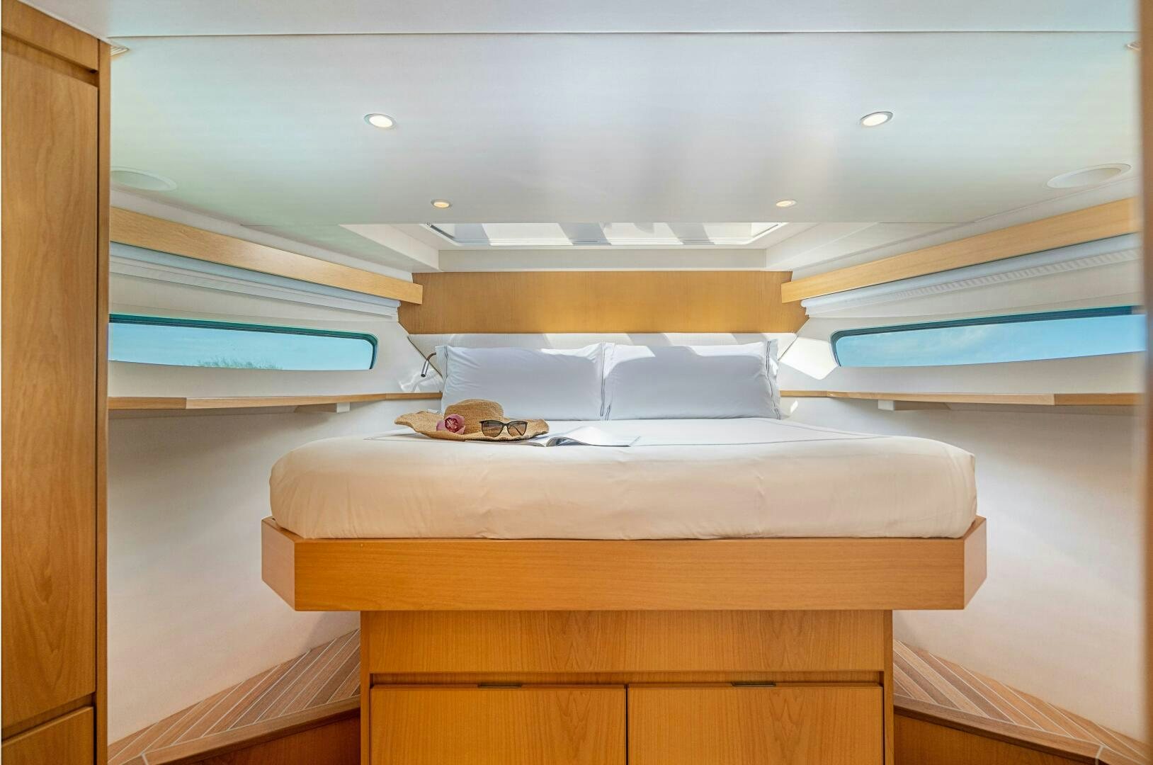 a bed with a wooden frame aboard MARYBELLE Yacht for Sale
