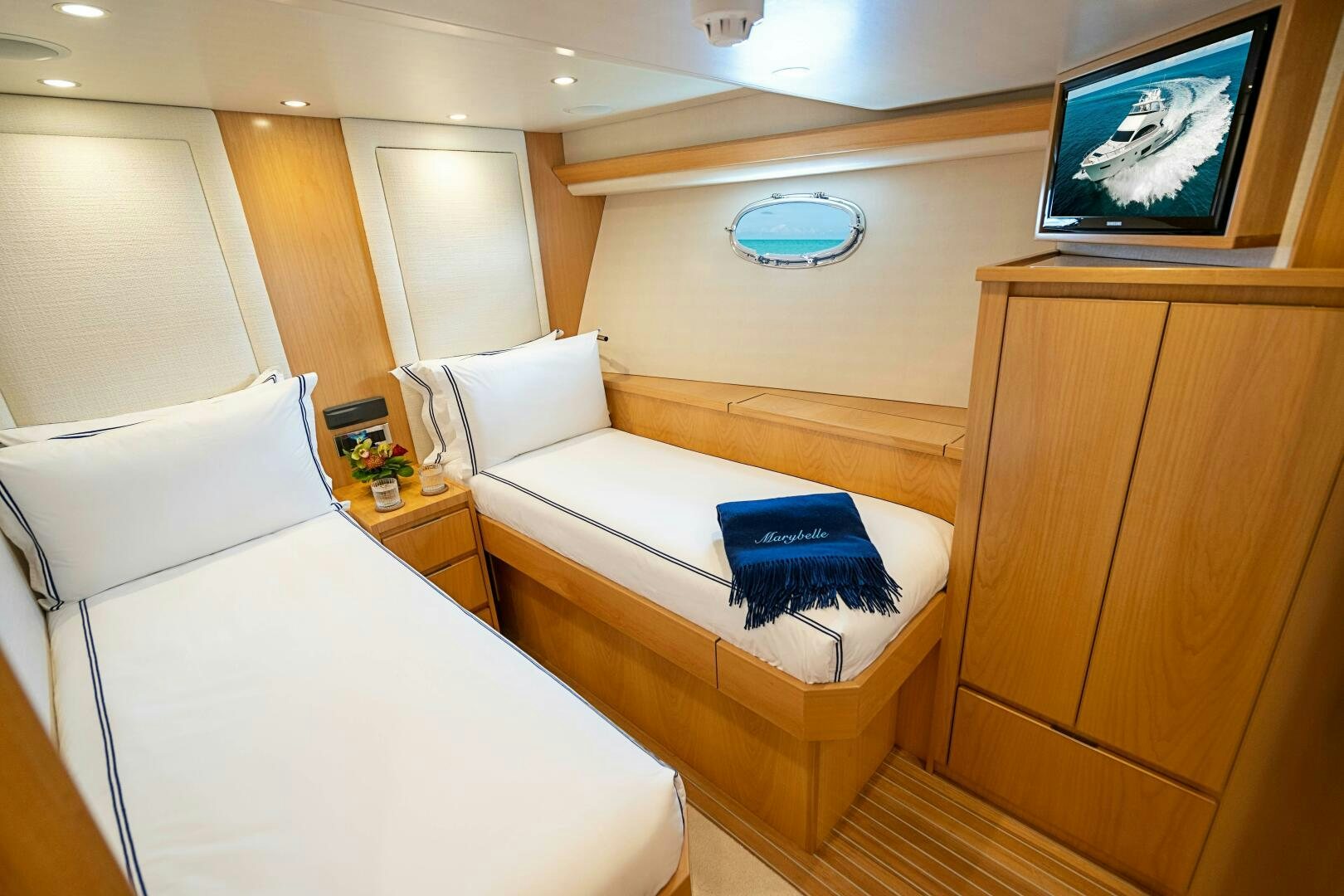a room with a bed and a television aboard MARYBELLE Yacht for Sale