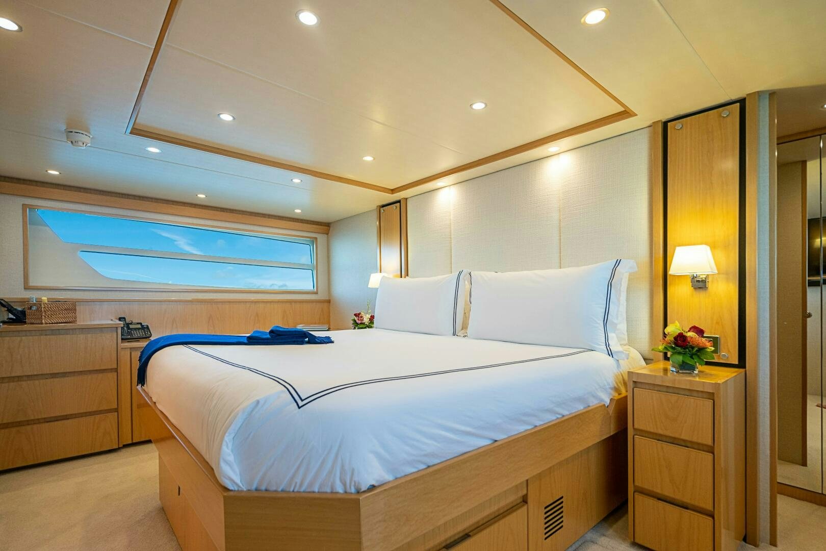 a bedroom with a bed and a desk aboard MARYBELLE Yacht for Sale
