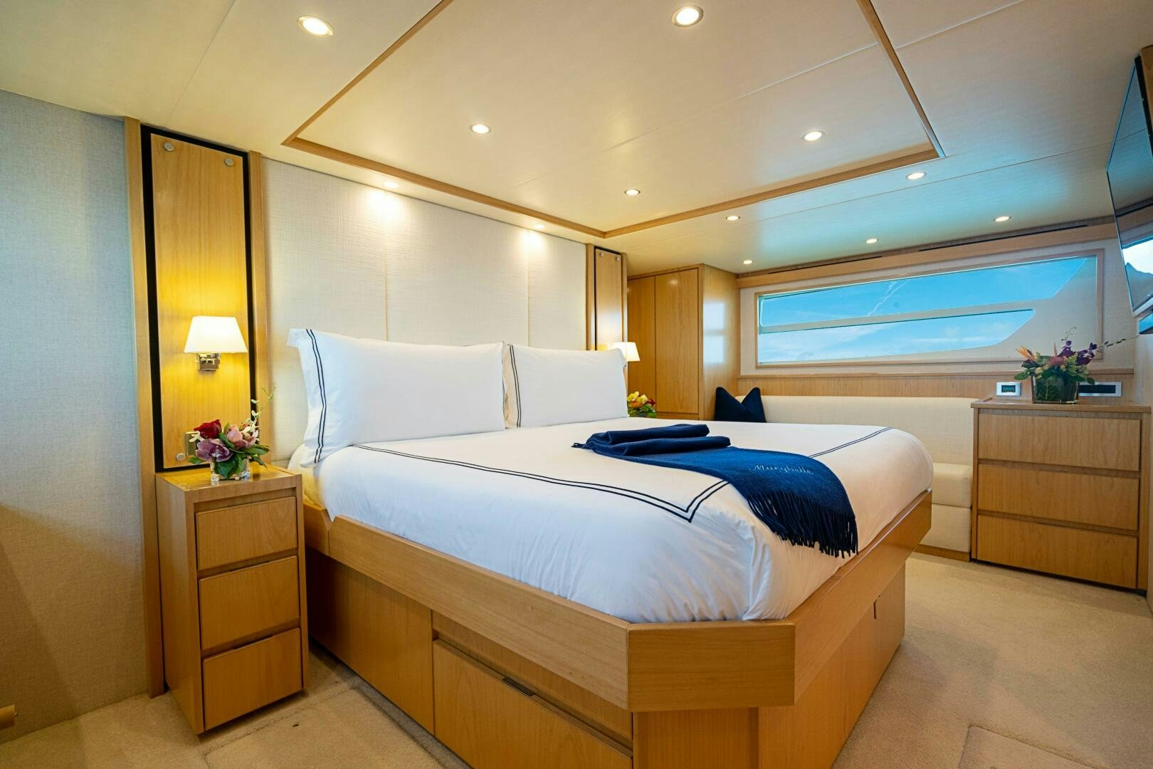 a bedroom with a bed and a desk aboard MARYBELLE Yacht for Sale