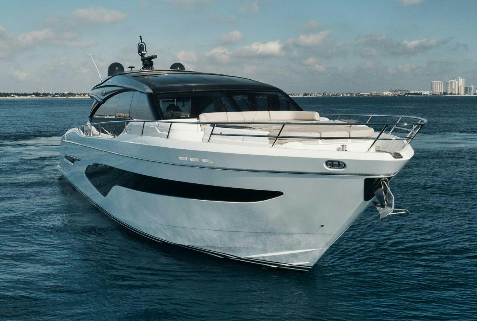 a white yacht in the water aboard HOOKED HER Yacht for Sale