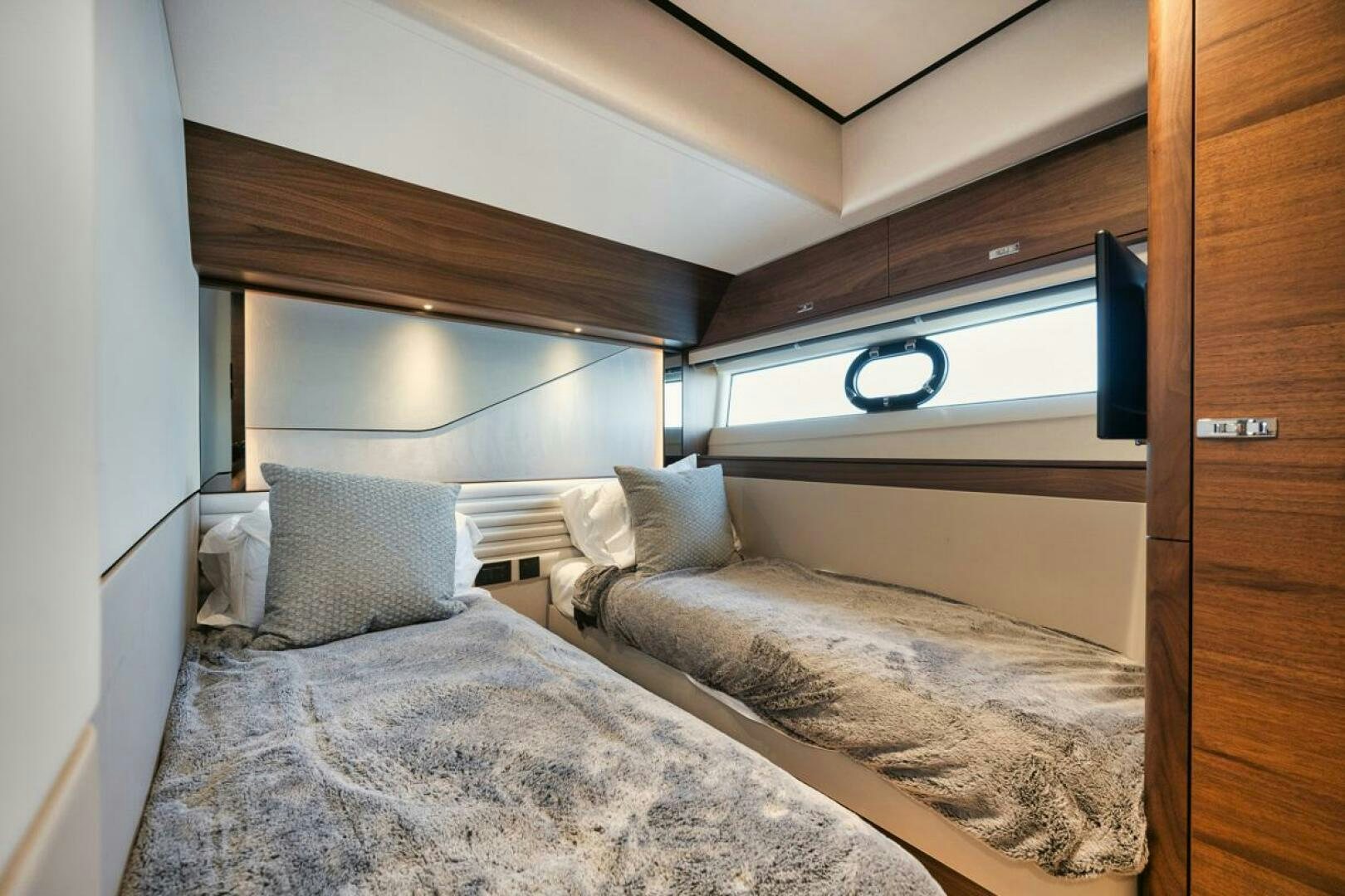 a room with two beds aboard HOOKED HER Yacht for Sale