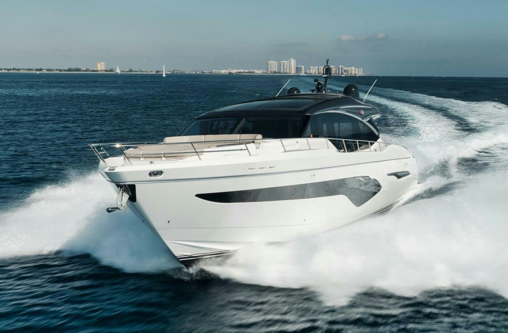 a white yacht on the water aboard HOOKED HER Yacht for Sale