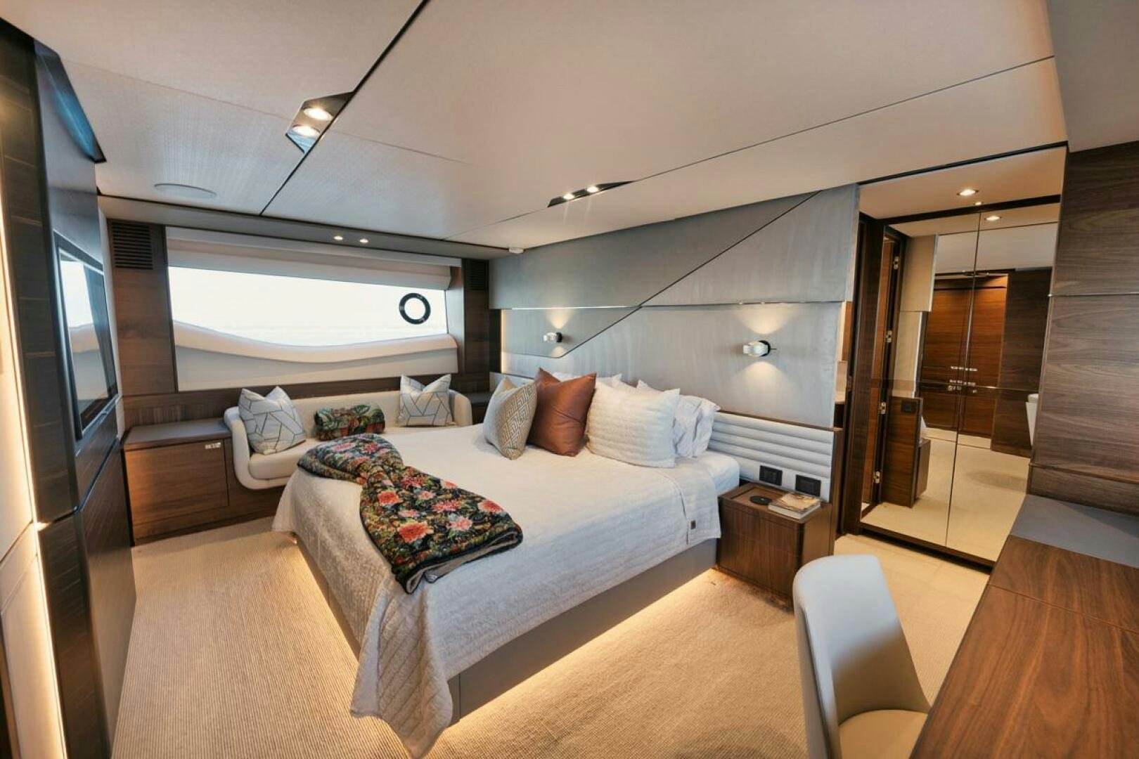 a bedroom with a large bed aboard HOOKED HER Yacht for Sale
