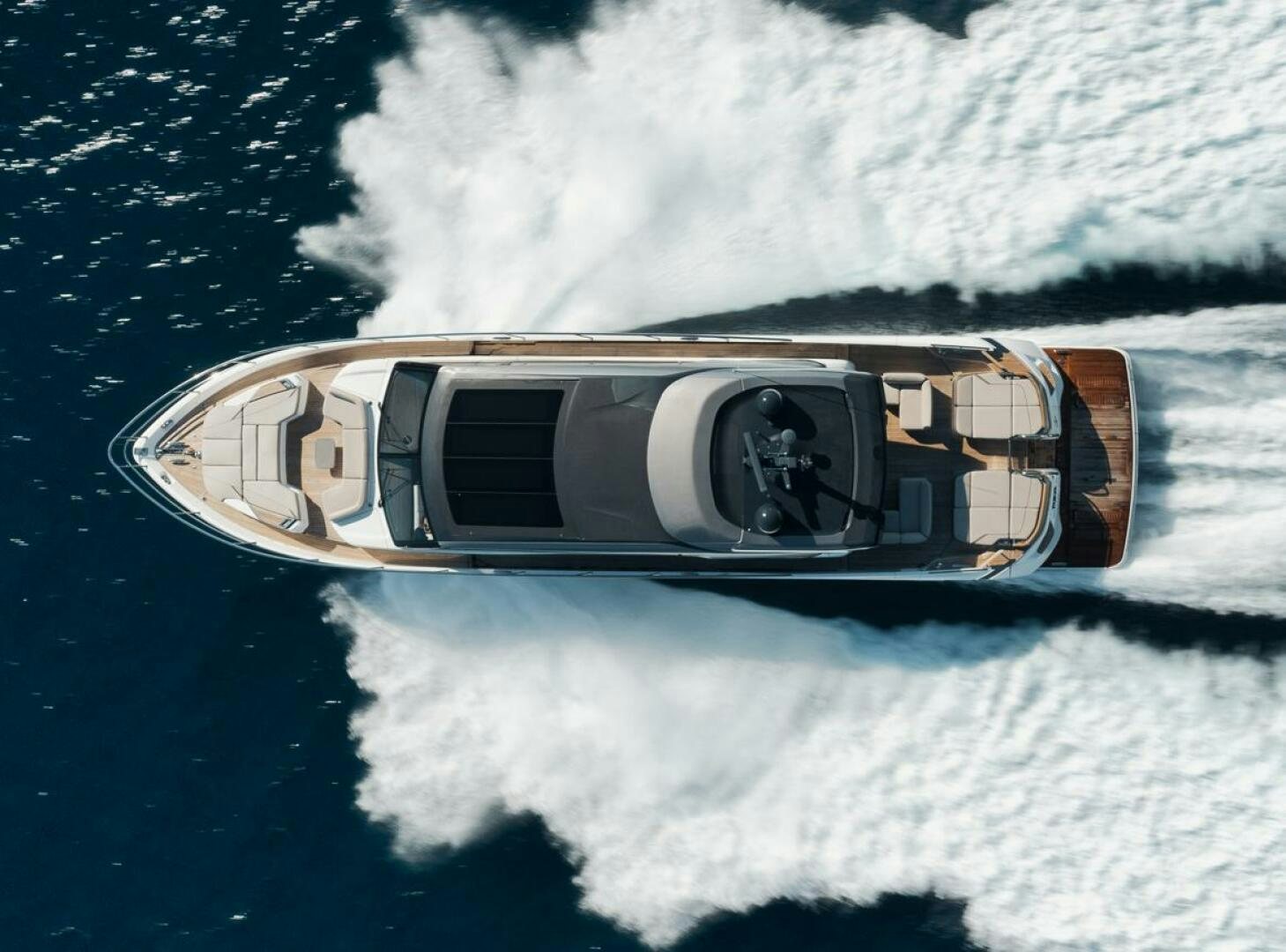 a bottle of alcohol on a snowy mountain aboard HOOKED HER Yacht for Sale