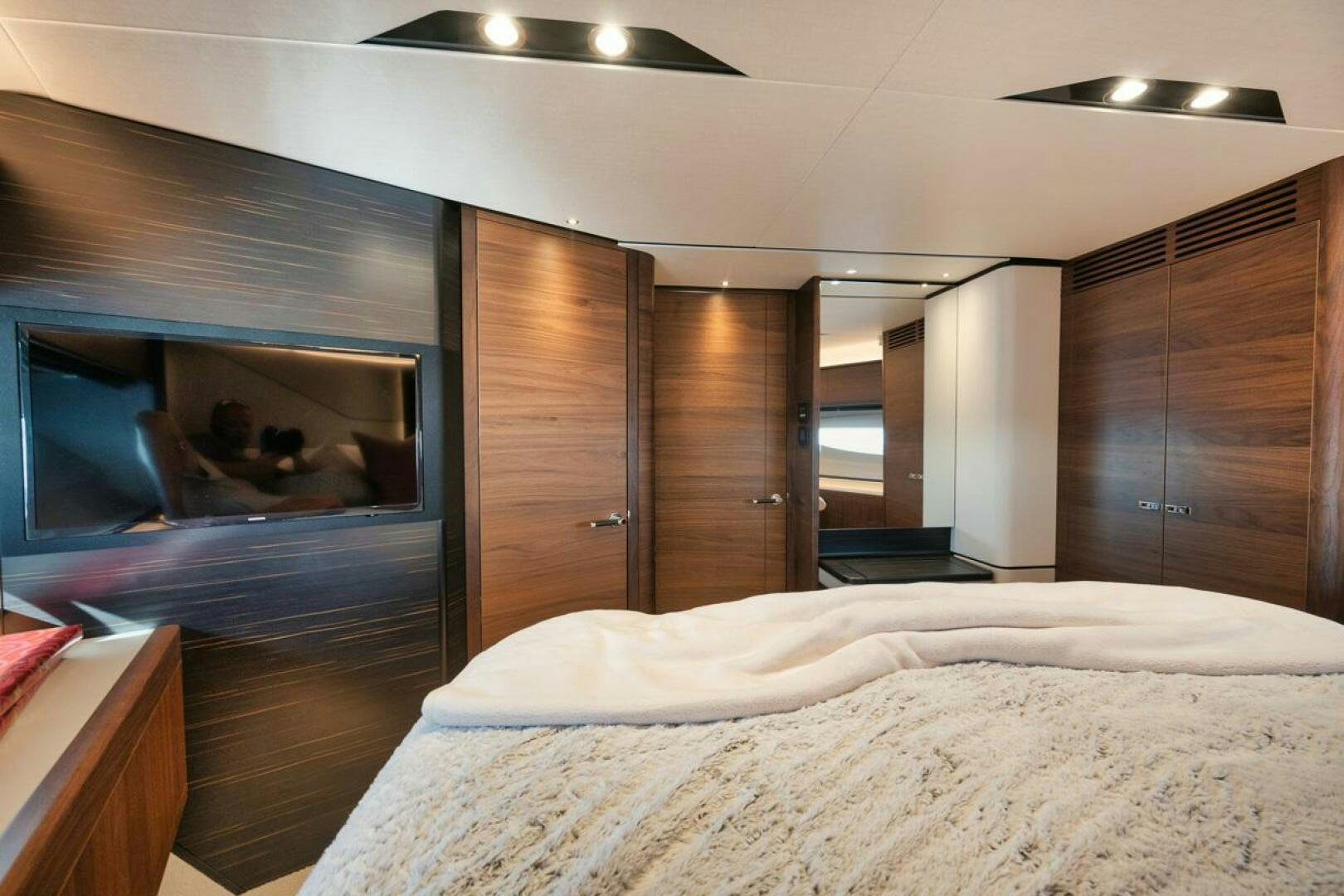 a bed in a room aboard HOOKED HER Yacht for Sale