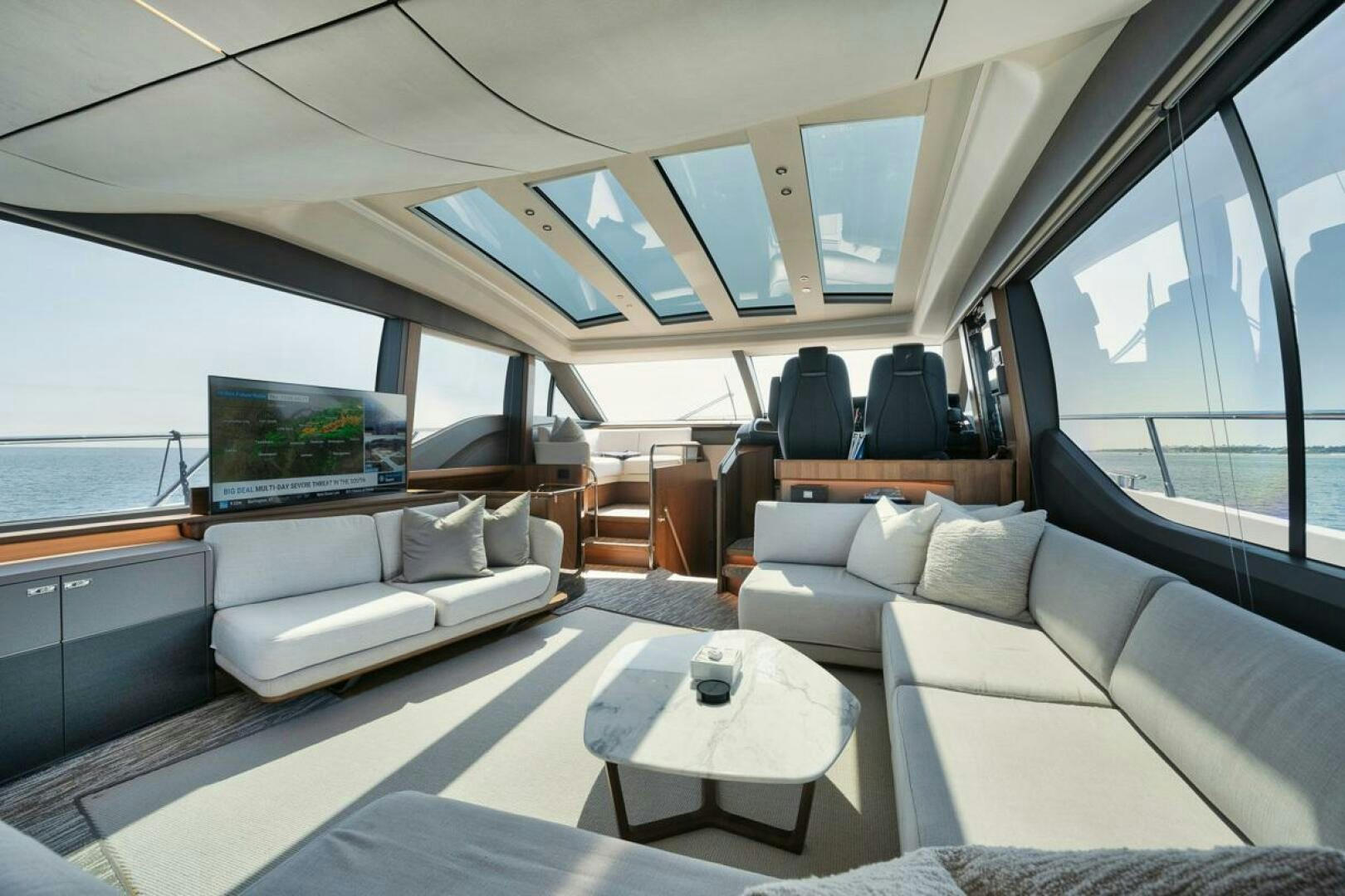 a boat with a large window aboard HOOKED HER Yacht for Sale