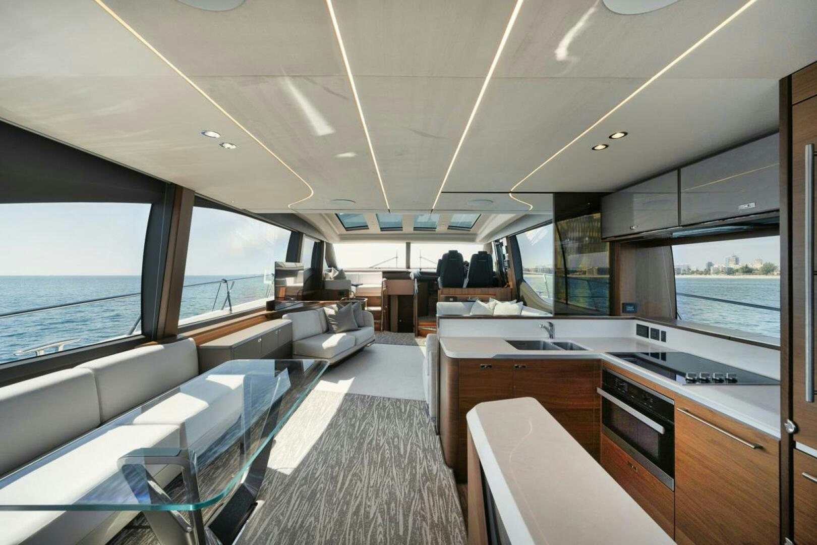 a boat with a large window aboard HOOKED HER Yacht for Sale