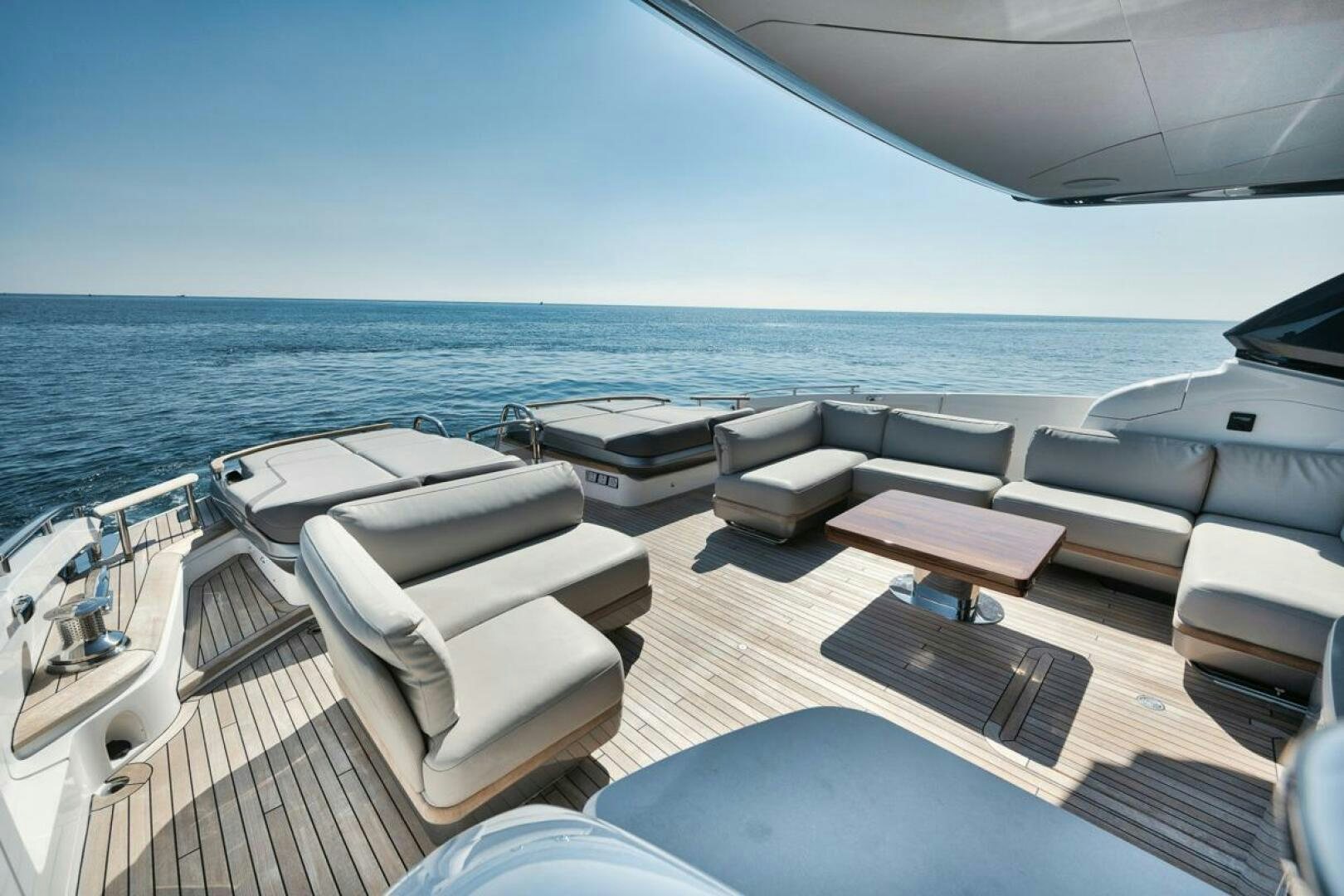 a deck with a view of the ocean and the ocean aboard HOOKED HER Yacht for Sale
