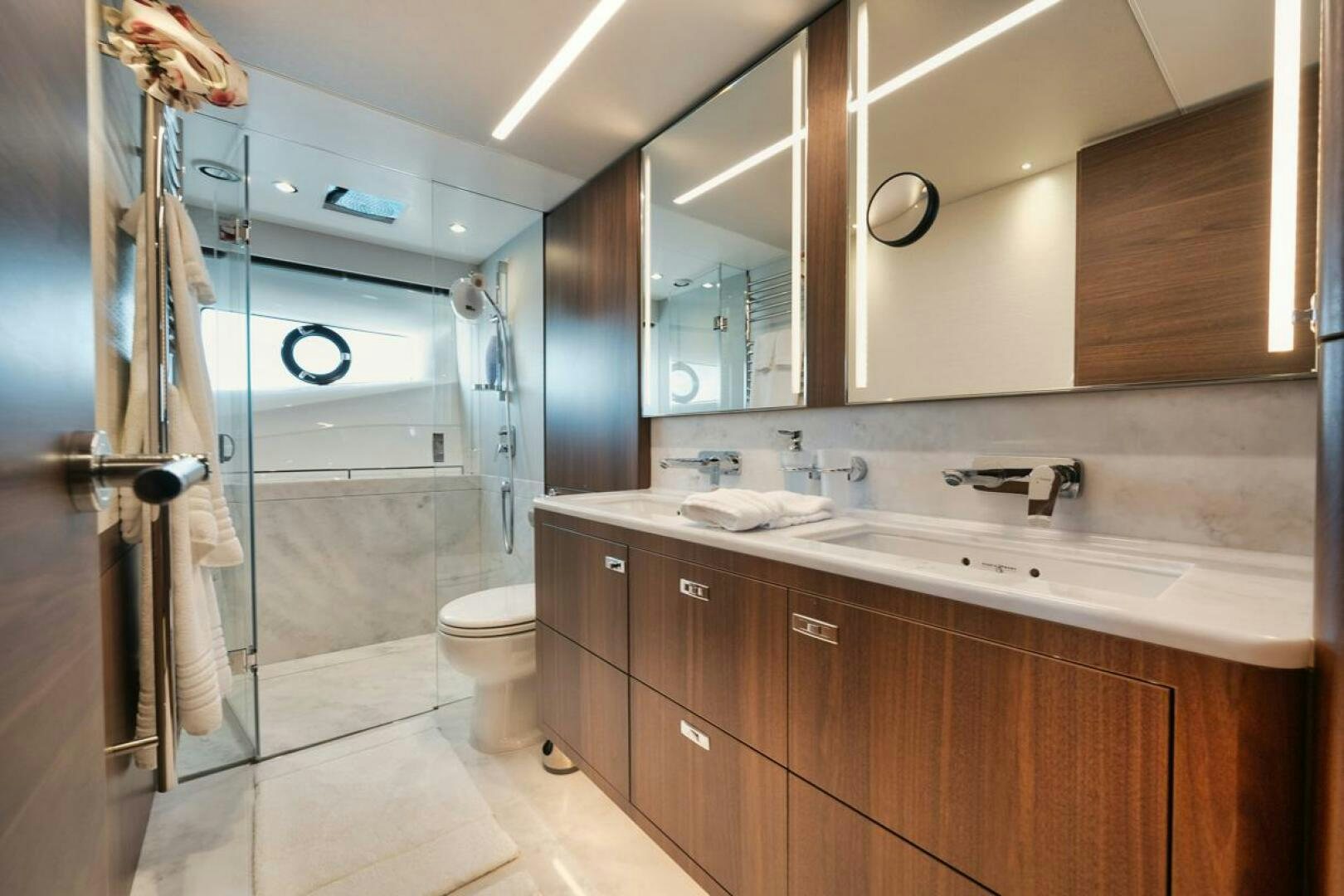 a bathroom with a glass shower aboard HOOKED HER Yacht for Sale