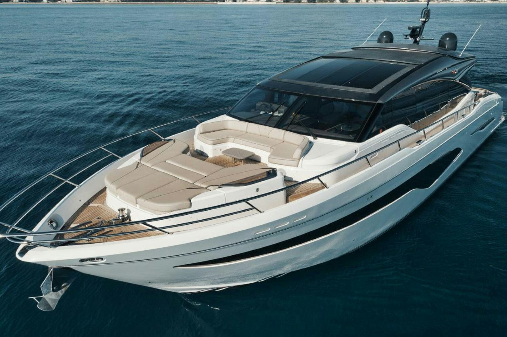 a white yacht on the water aboard HOOKED HER Yacht for Sale