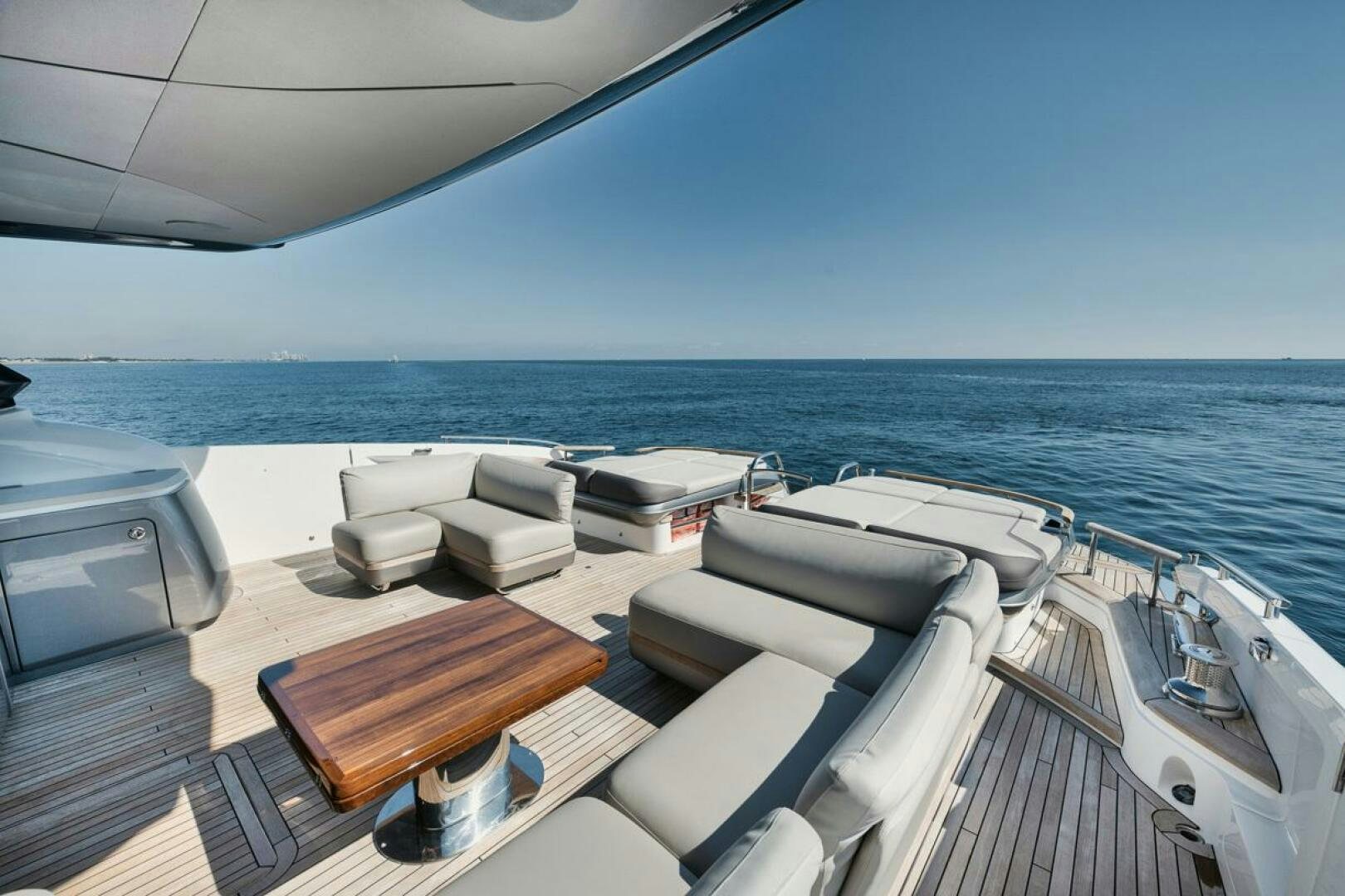 a deck with a view of the ocean and the ocean aboard HOOKED HER Yacht for Sale