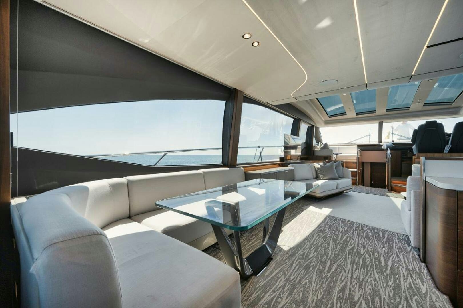 a large living room with a large window aboard HOOKED HER Yacht for Sale