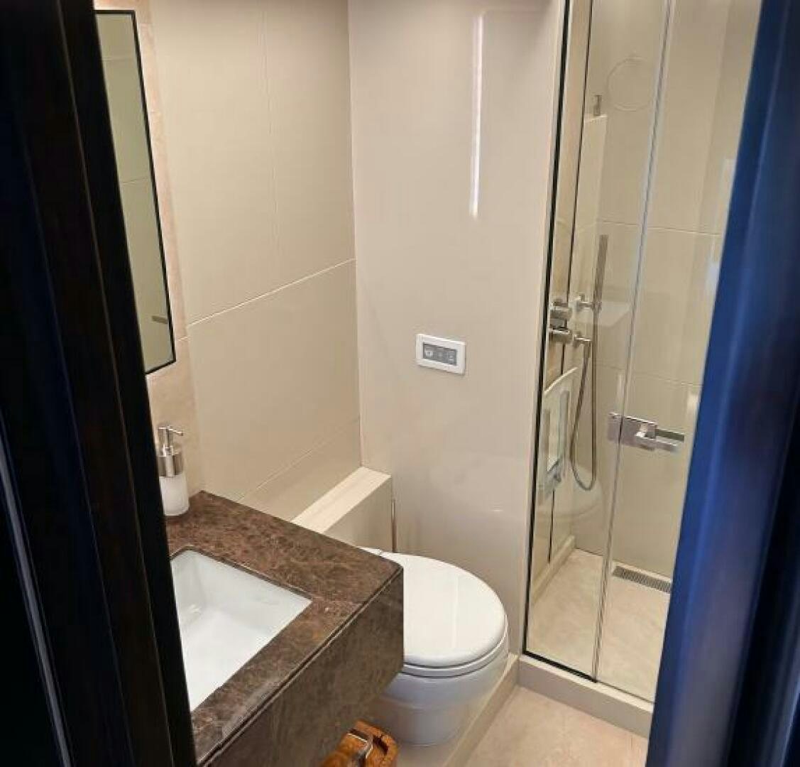 a bathroom with a sink and a shower aboard PITERLAND II Yacht for Sale