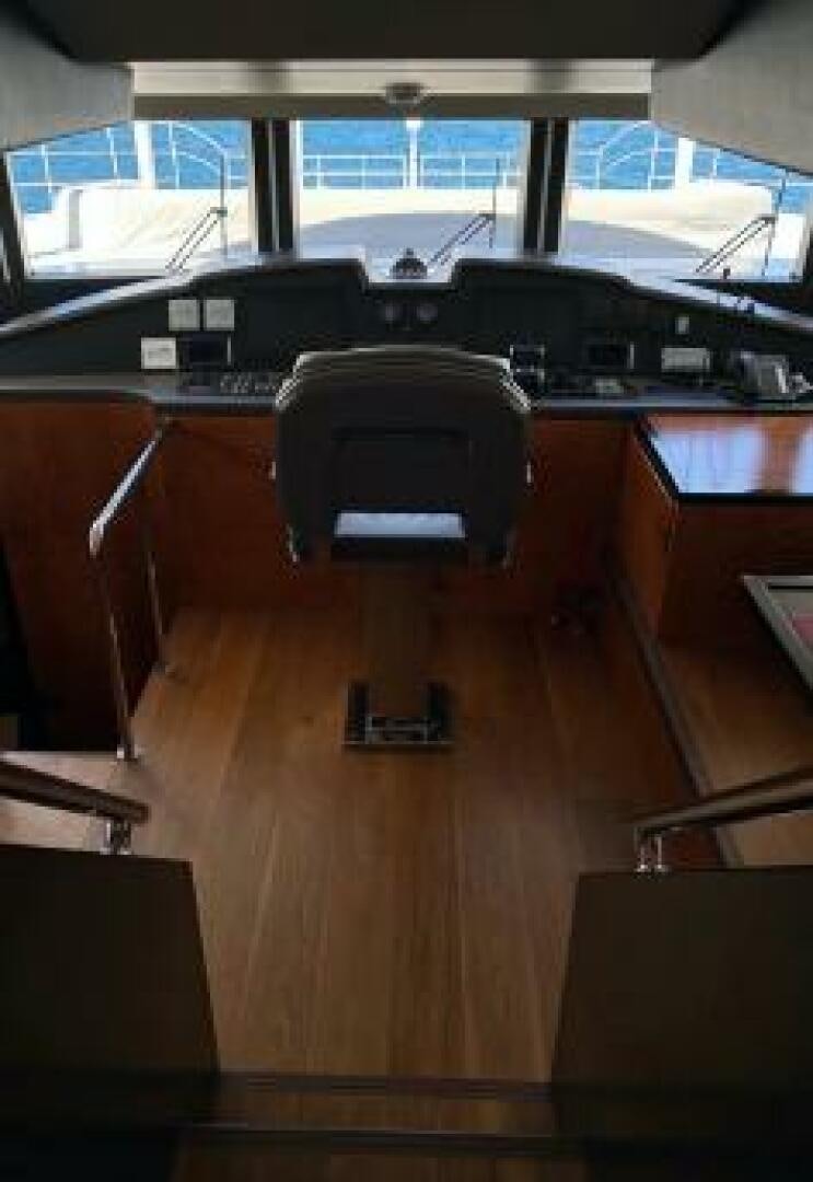 a desk with a computer and a chair aboard PITERLAND II Yacht for Sale