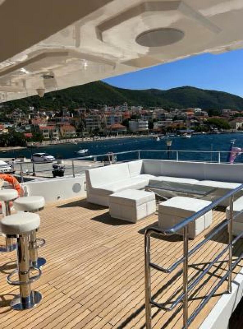 a deck with a view of a city and water aboard PITERLAND II Yacht for Sale