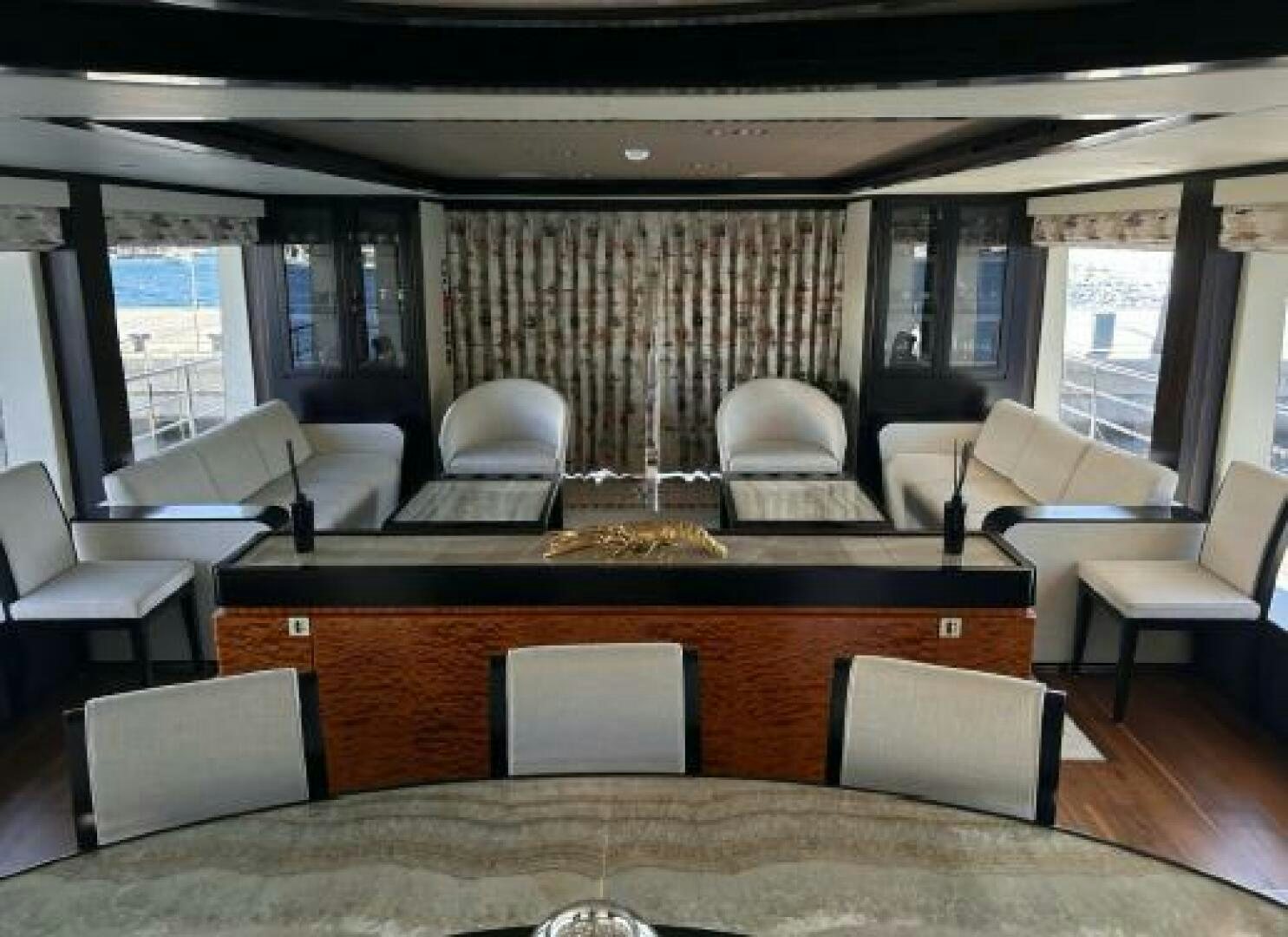 a large room with a table and chairs aboard PITERLAND II Yacht for Sale