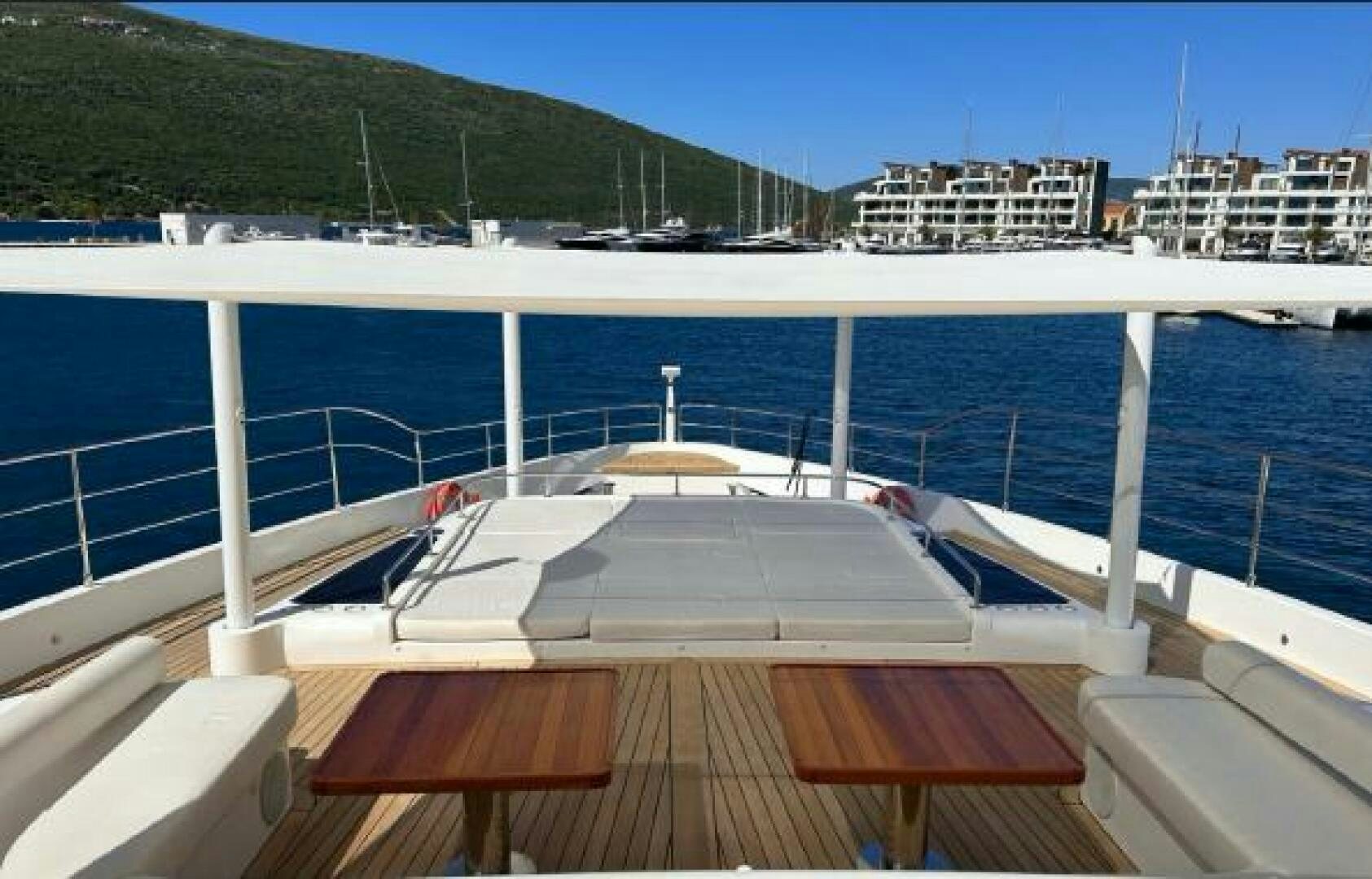 a deck with a view of a city and a body of water aboard PITERLAND II Yacht for Sale